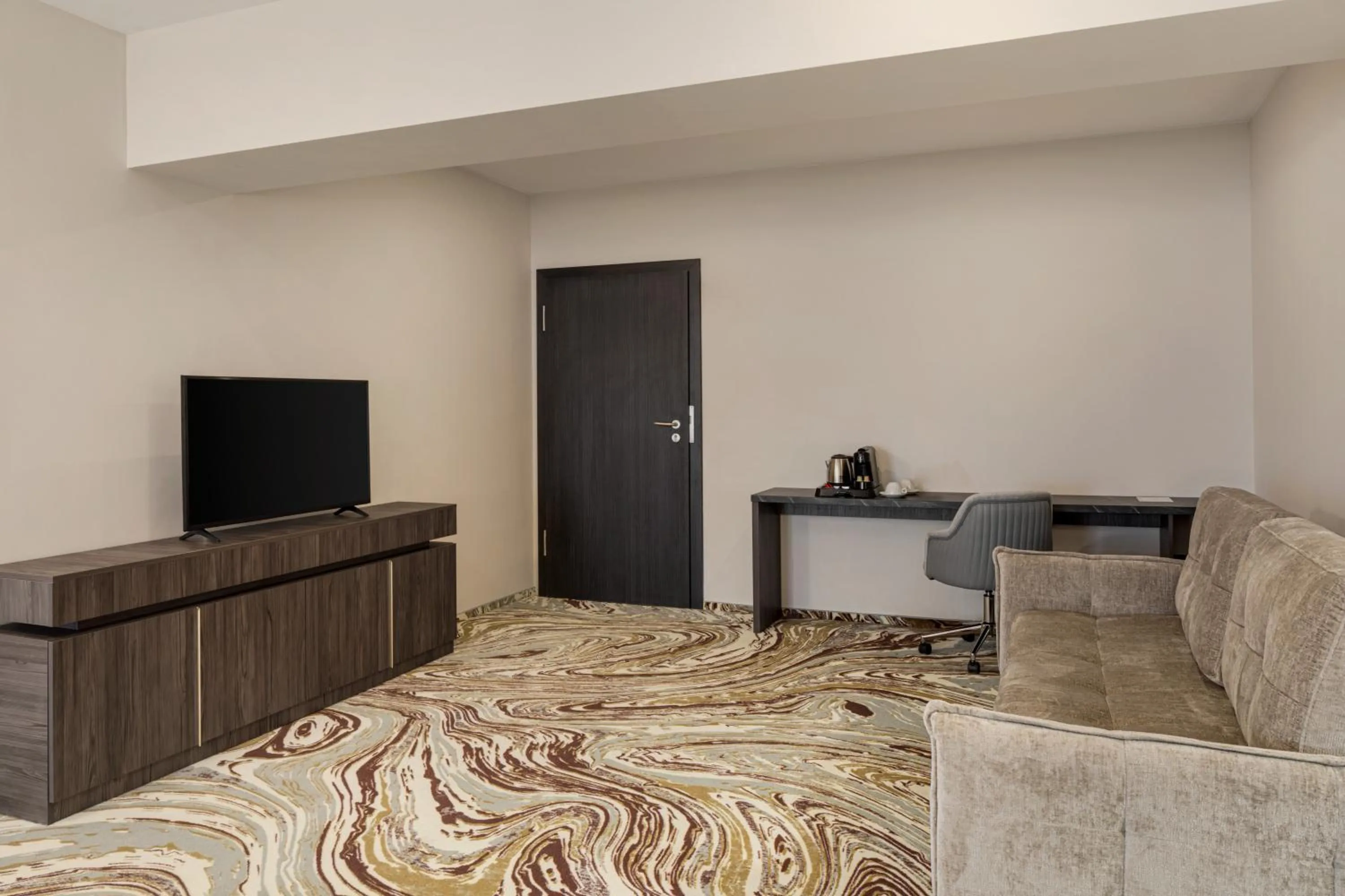 Living room in Ramada by Wyndham Bucharest Otopeni Airport