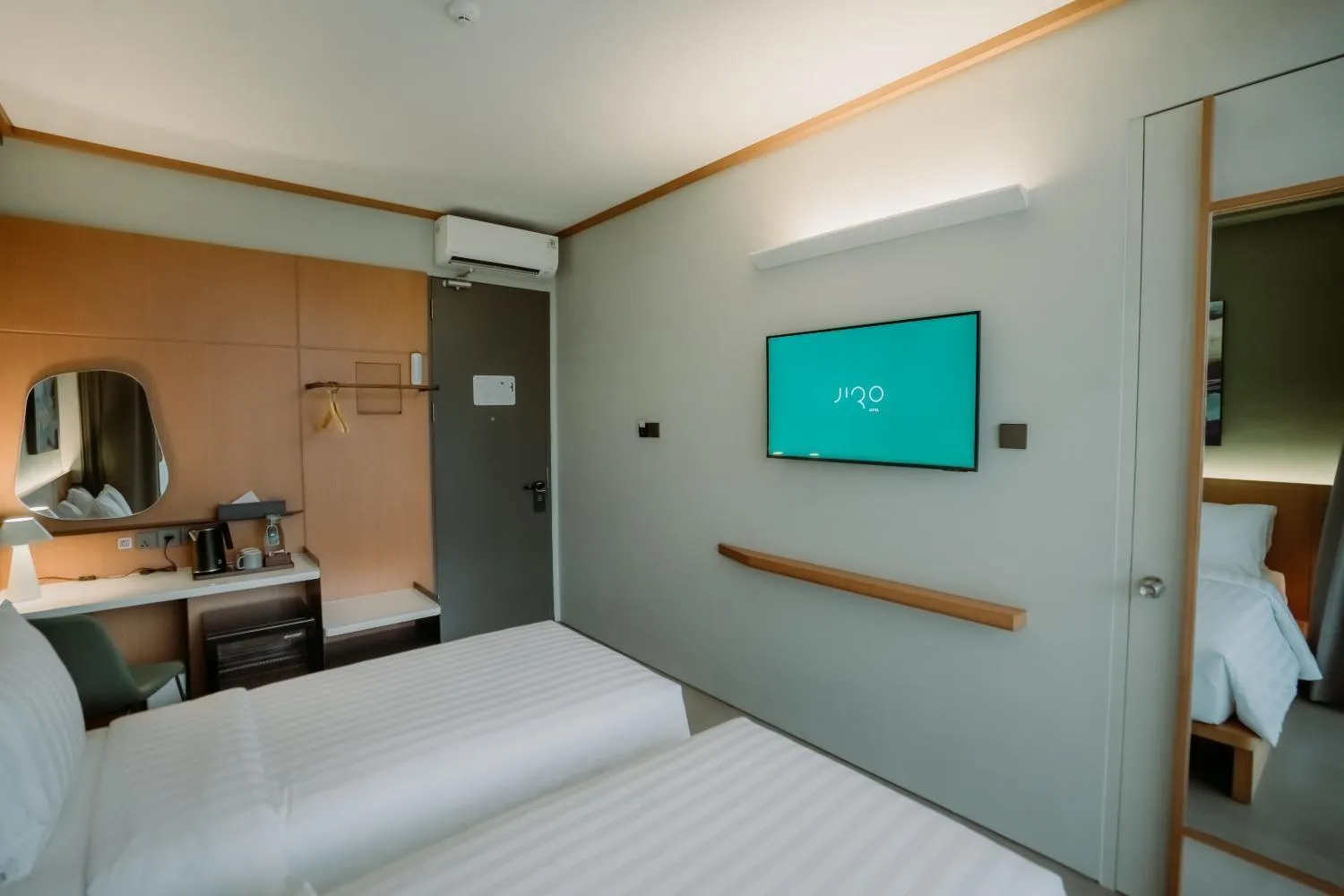 Bed in Jiro Hotel