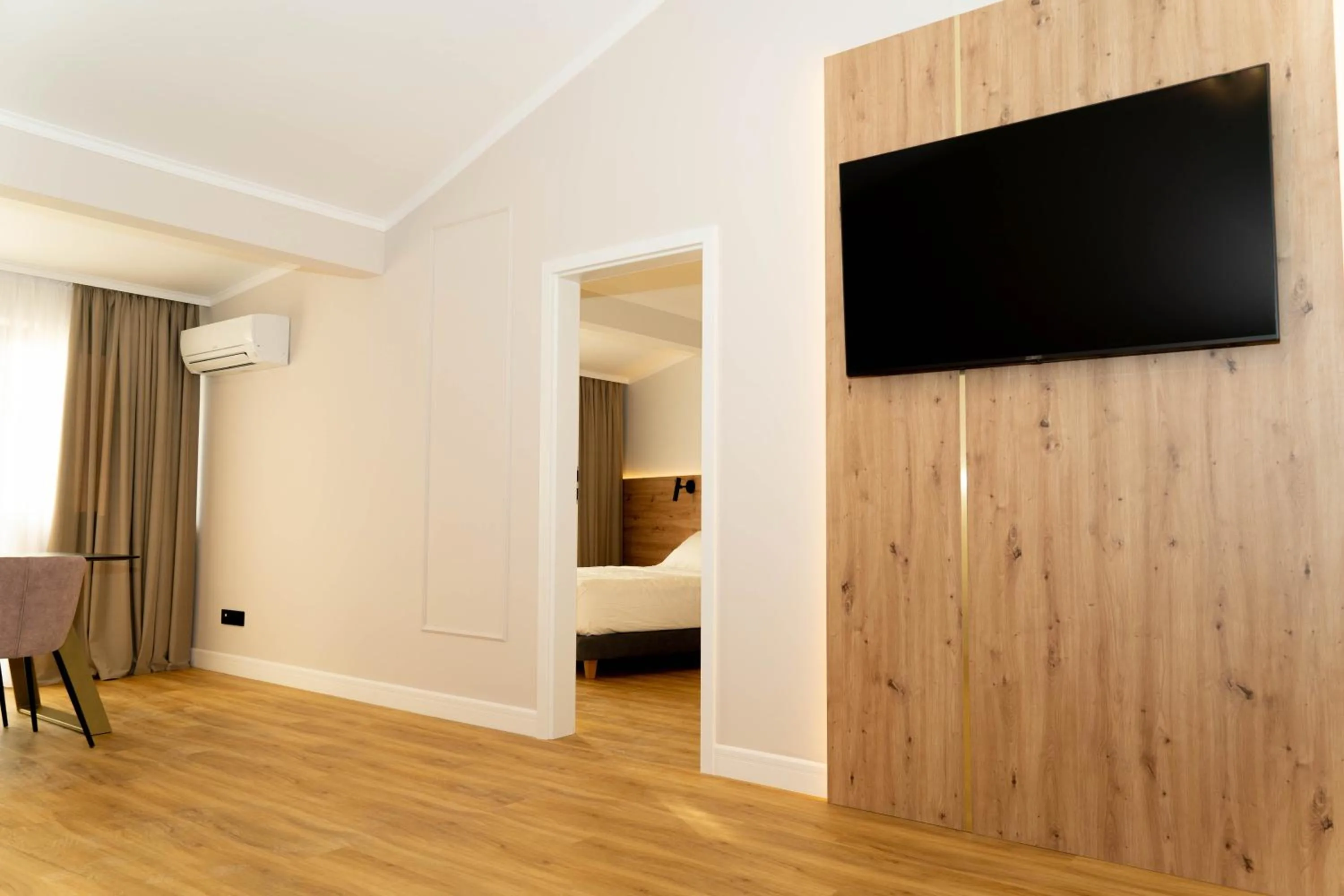 Living room, Bed in Bloom Downtown Suites