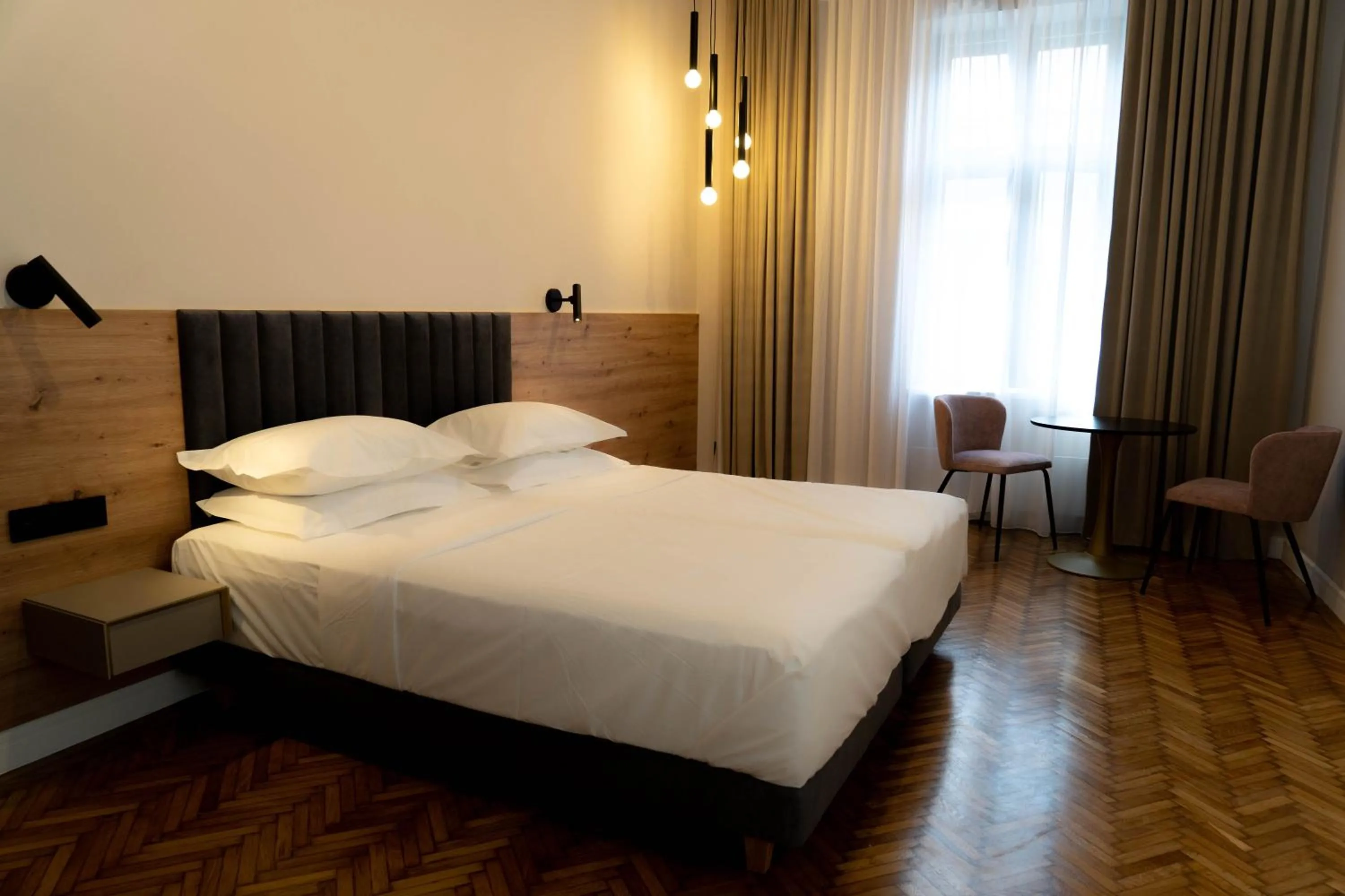 Bed in Bloom Downtown Suites