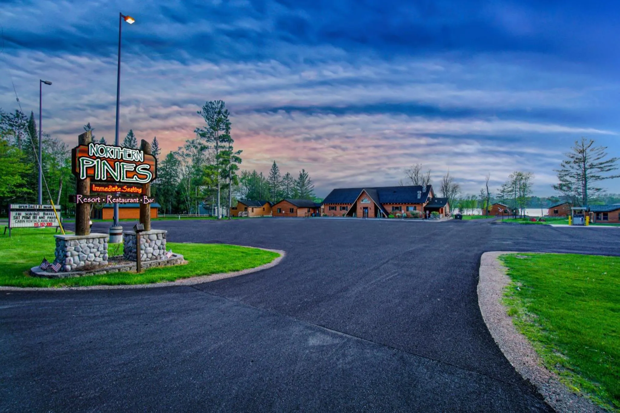 Property logo or sign in Lena's Northern Pines Resort
