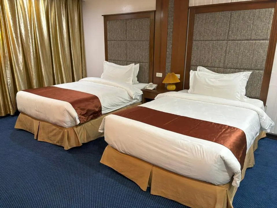 Bed in Lido De Paris Hotel