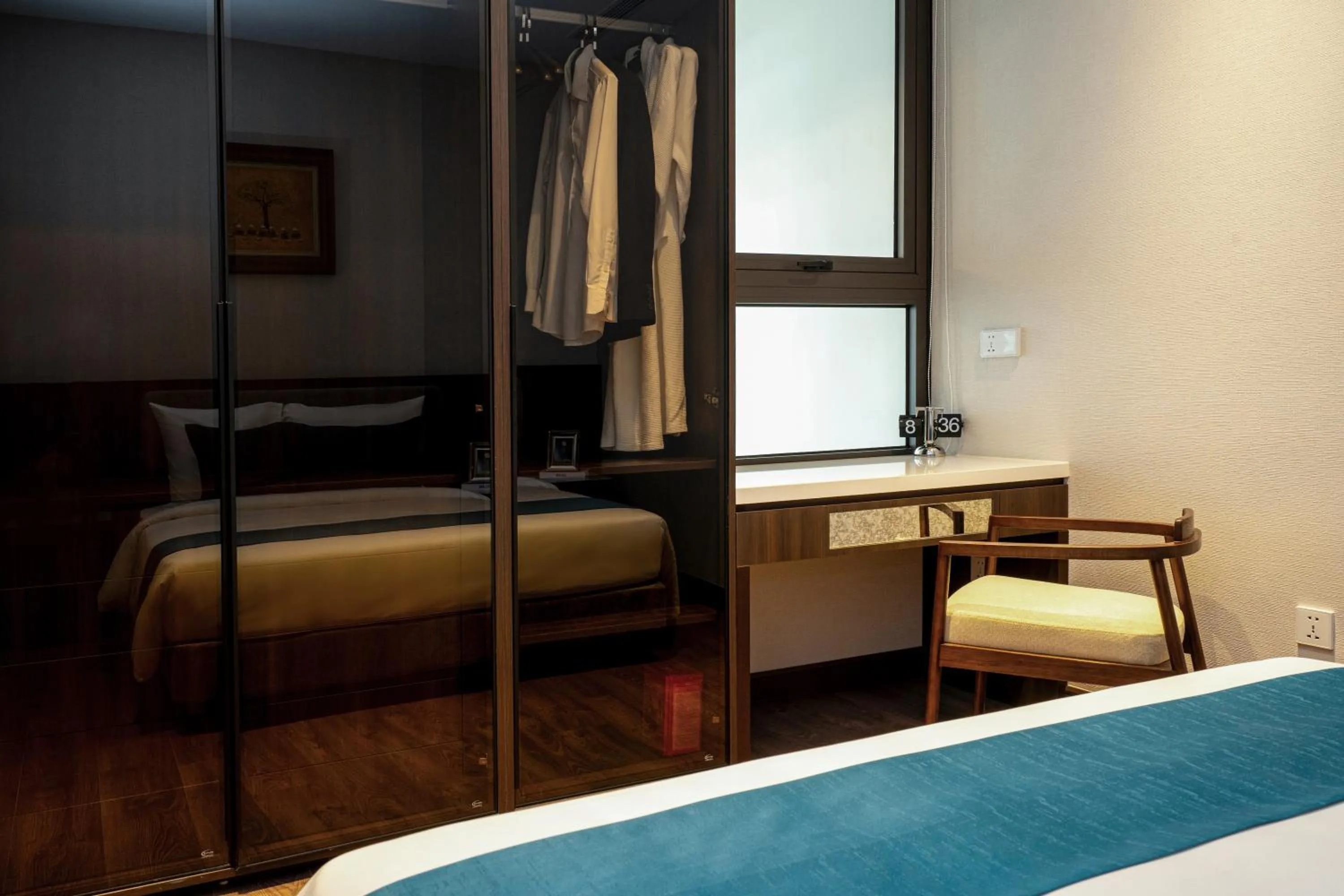 wardrobe, Bed in The Gloria Serviced Apartment by Silk Path