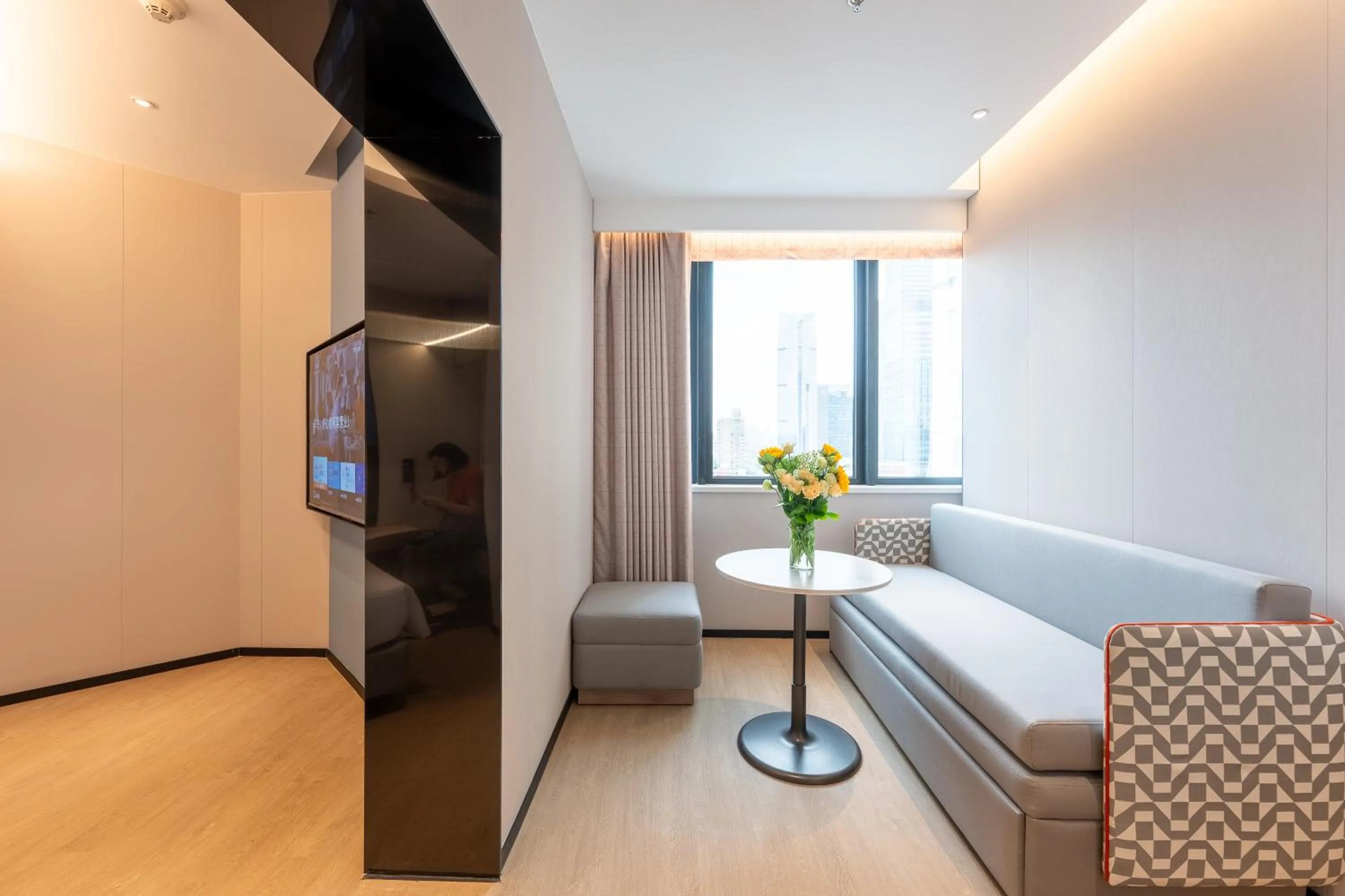 Living room in Holiday Inn Express Shanghai Jing'an Temple by IHG
