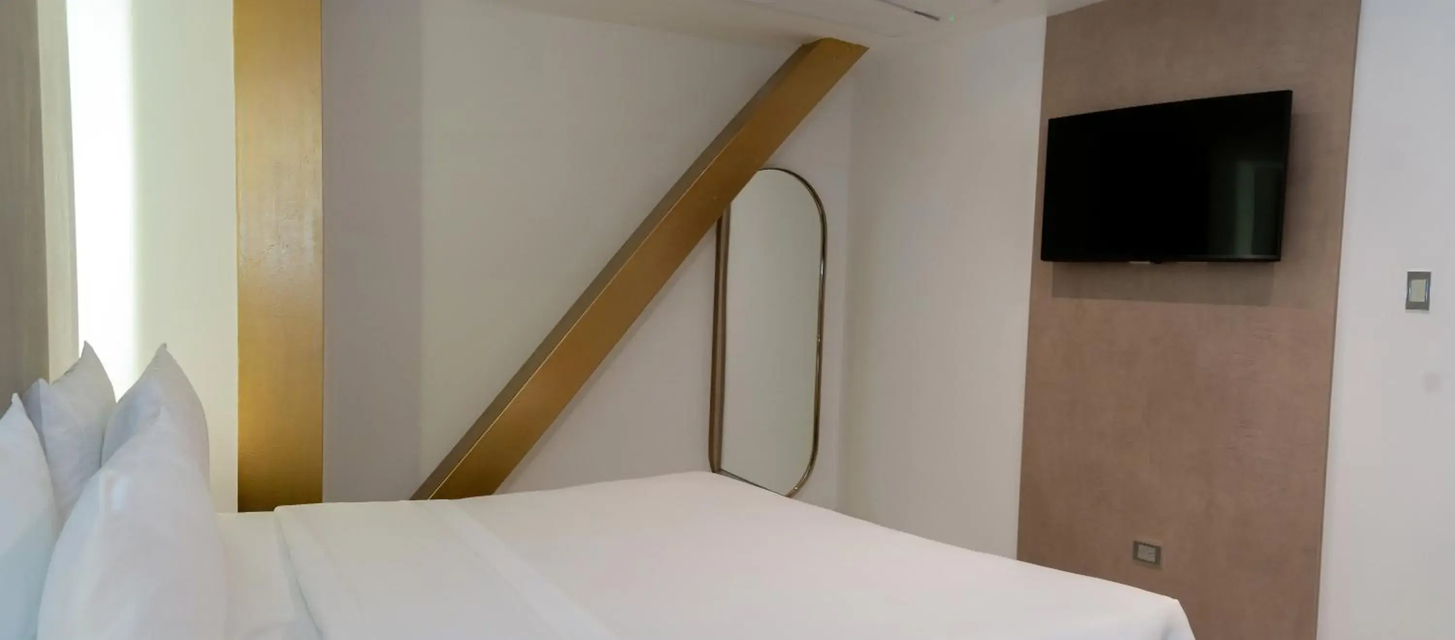 Bed in Delamar Hotel Bed in Delamar Hotel