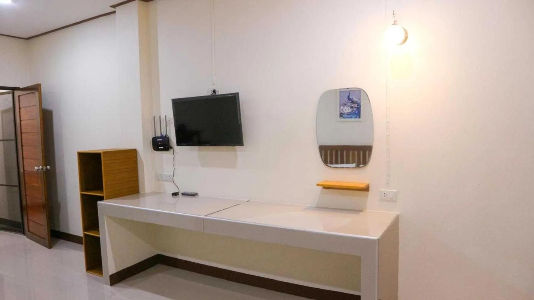 Bedroom in Capital O 75521 Sang Siri Apartment