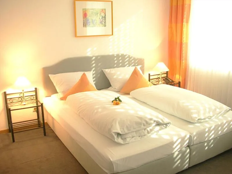 Bed in Posthotel Monegro