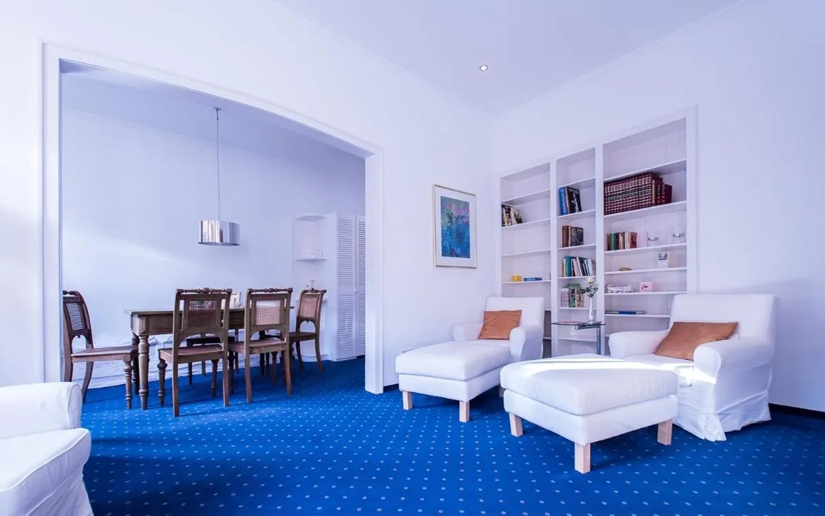 Living room, Bed in Posthotel Monegro