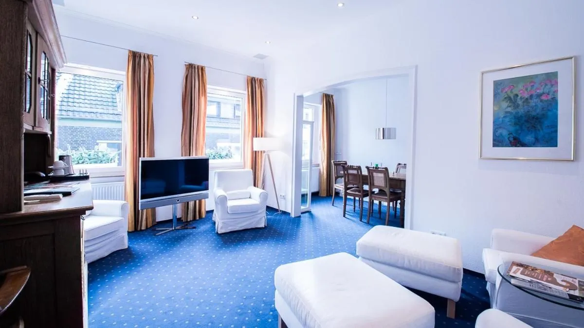 Communal lounge/ TV room in Posthotel Monegro