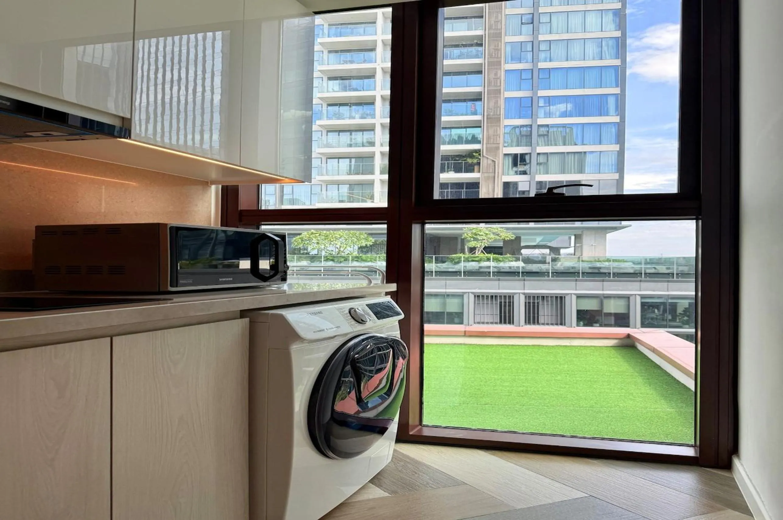 washing machine in The Metropole - Horizon View Riverside D2