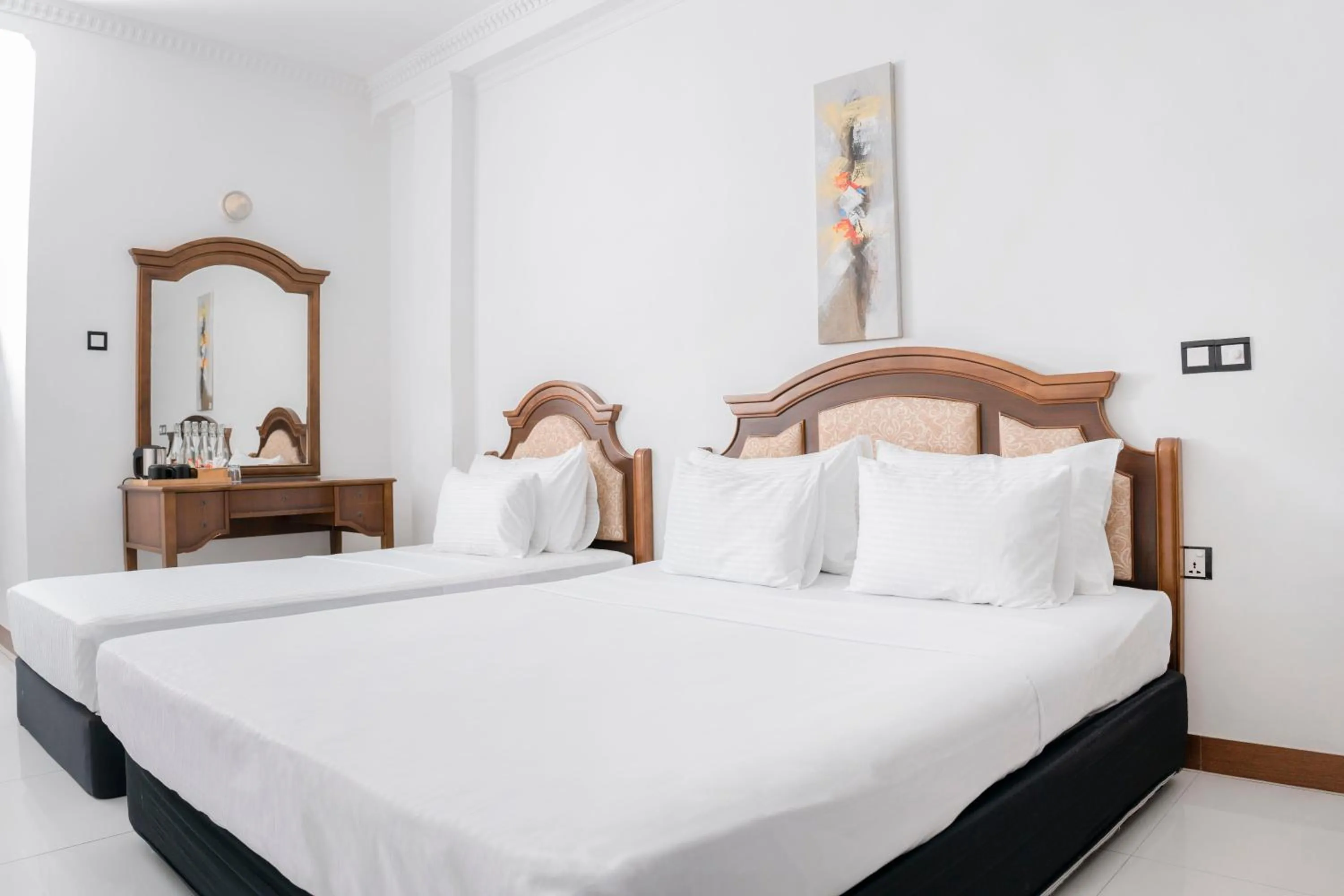 Bed in Gallery City Hotel