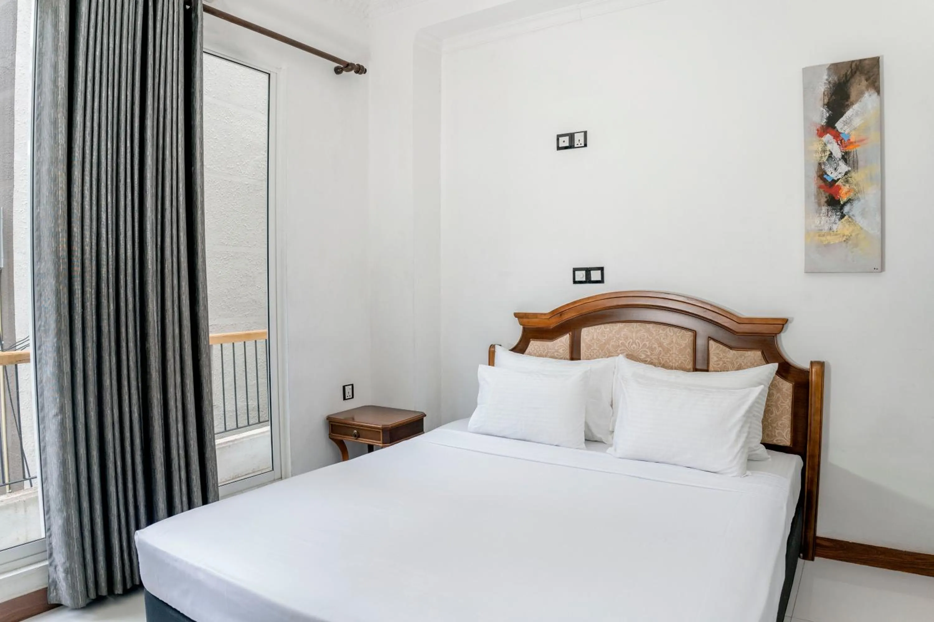 Bed in Gallery City Hotel