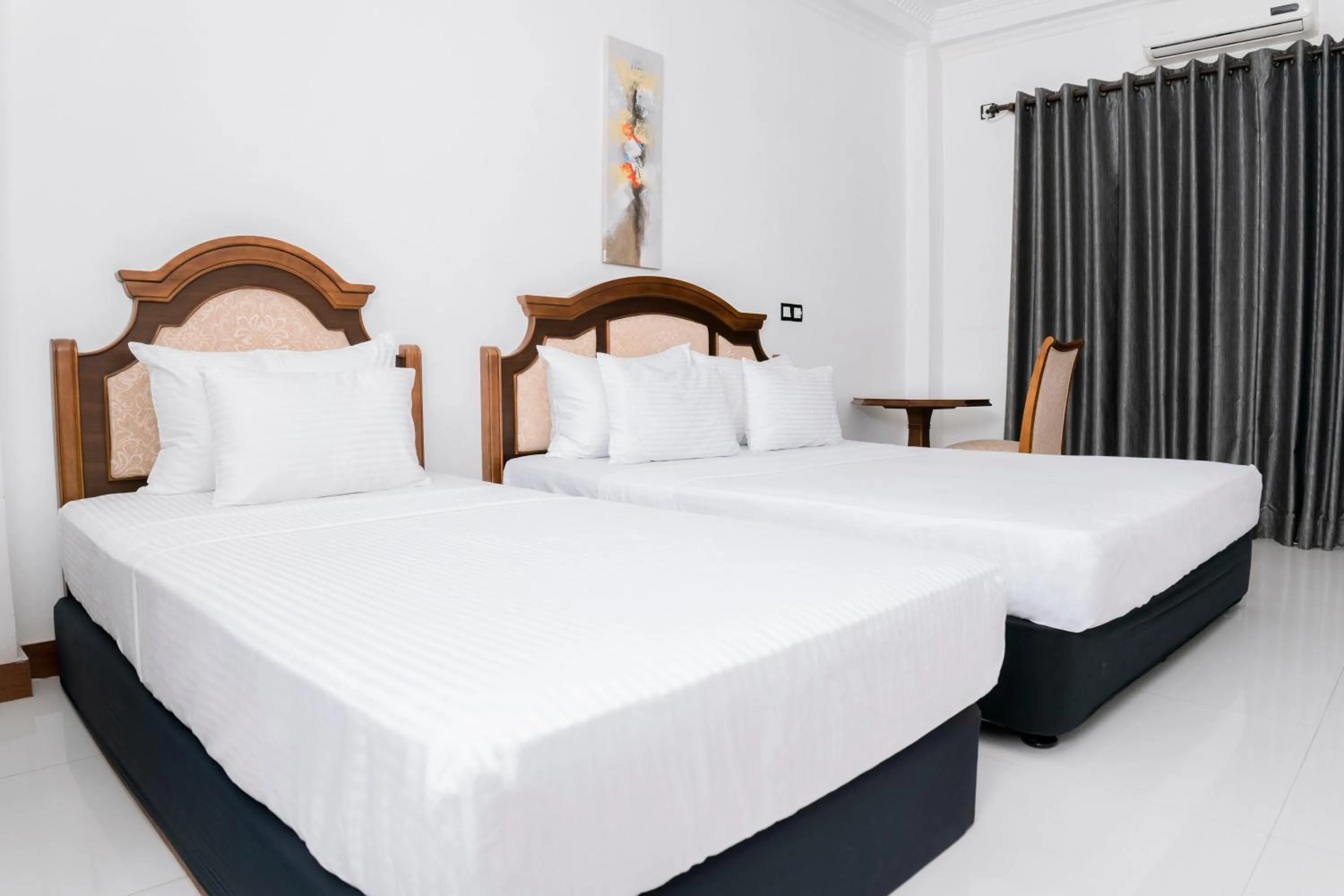 Bed in Gallery City Hotel