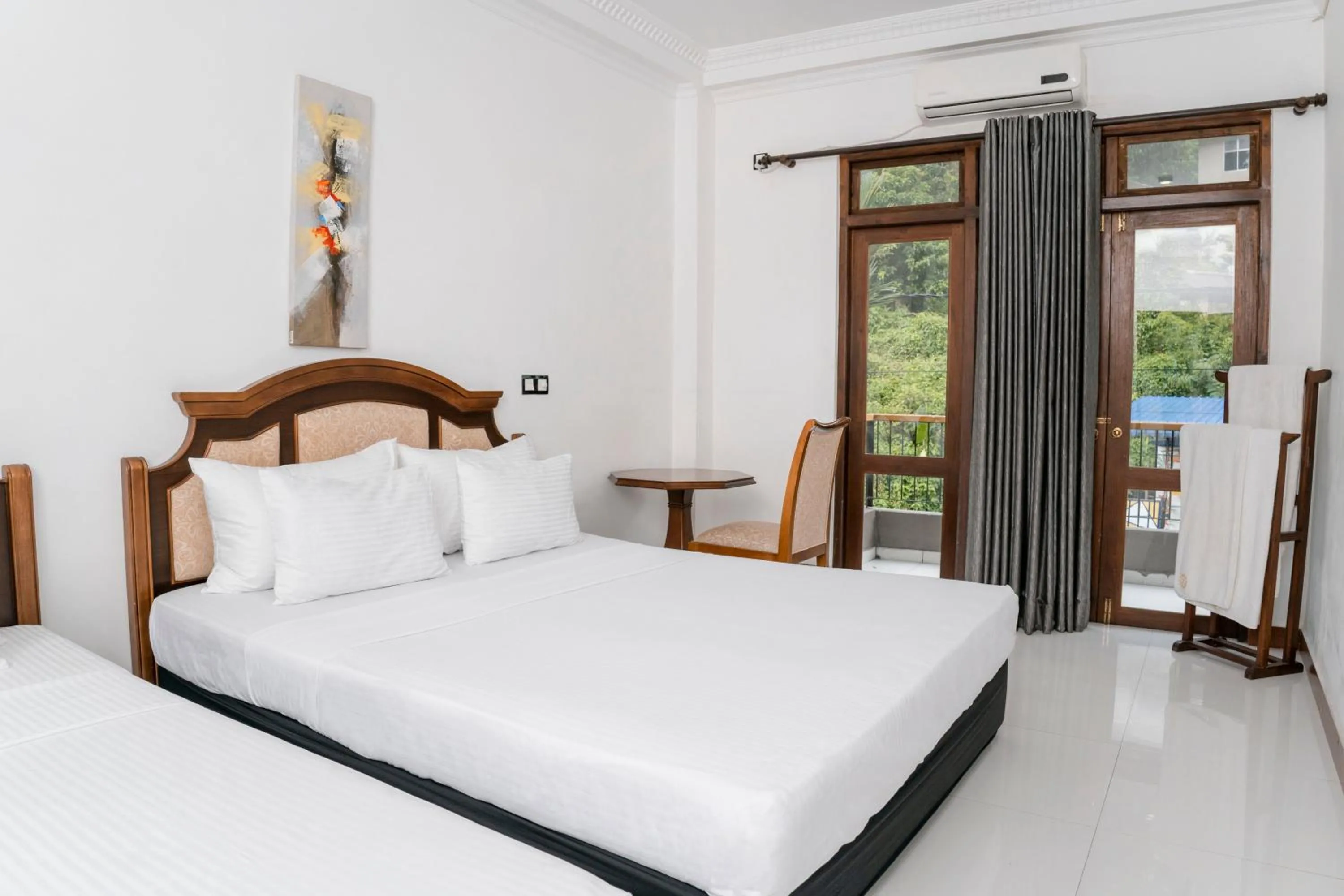 Bed in Gallery City Hotel