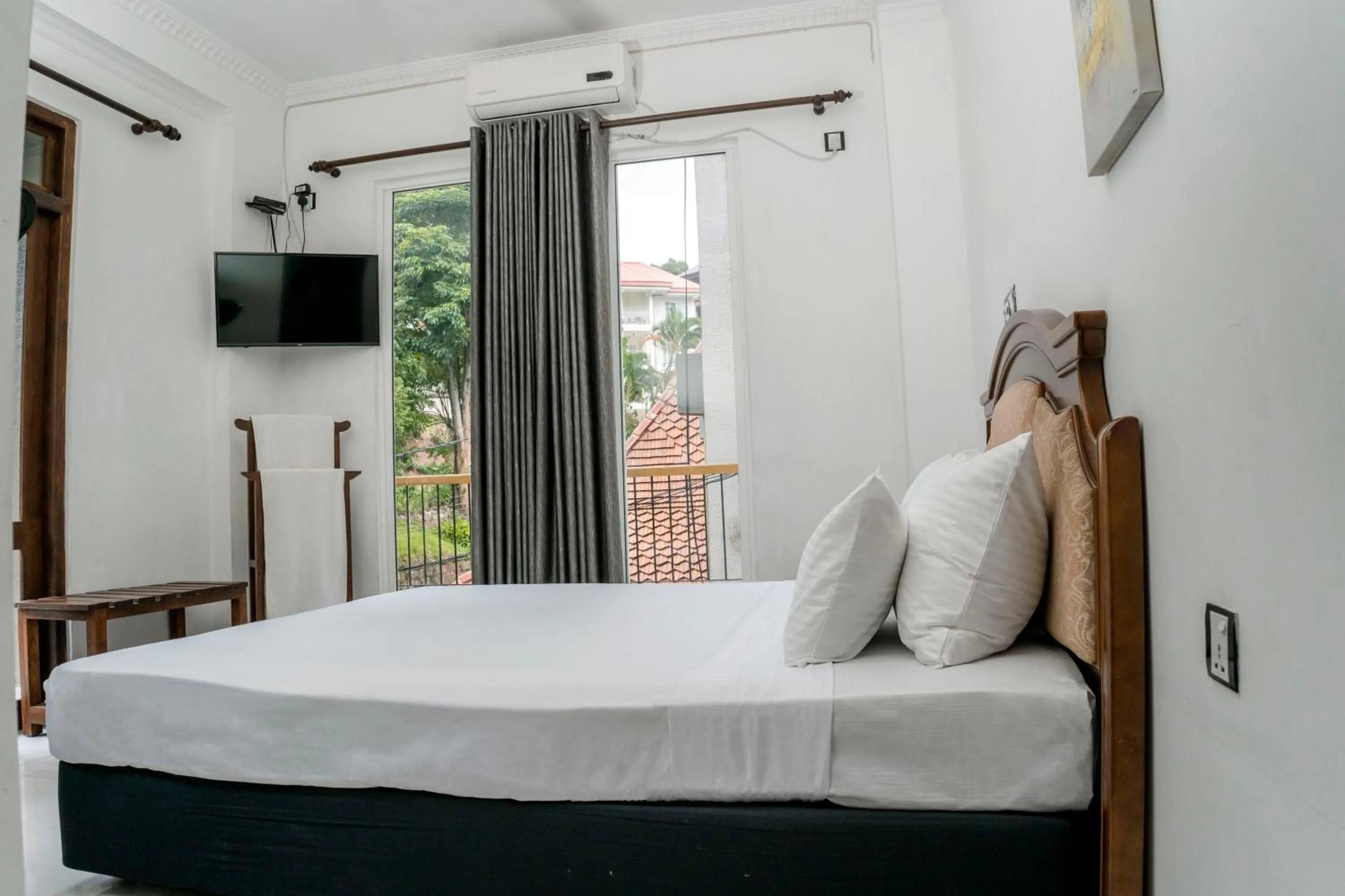 Bed in Gallery City Hotel
