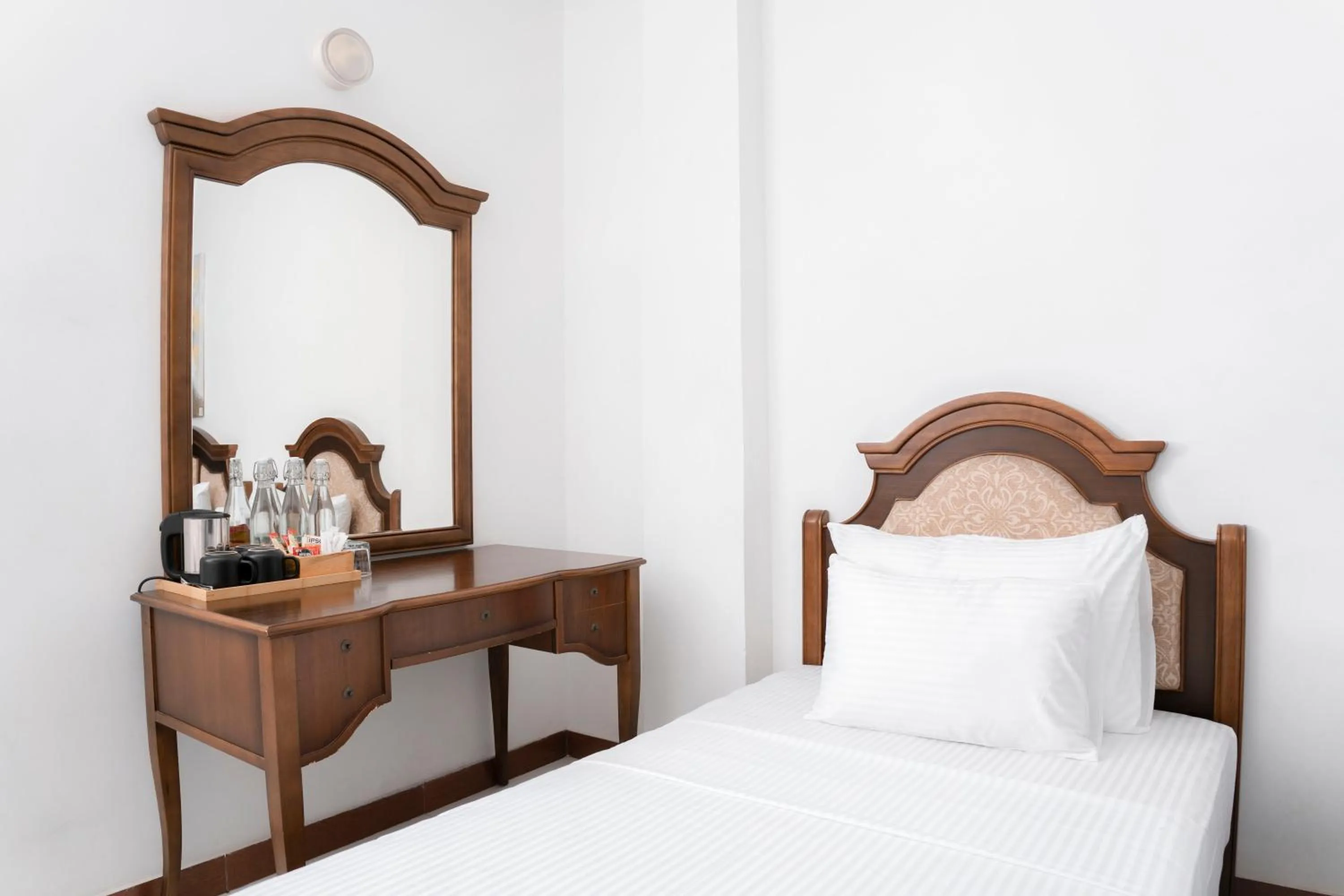 Bed in Gallery City Hotel