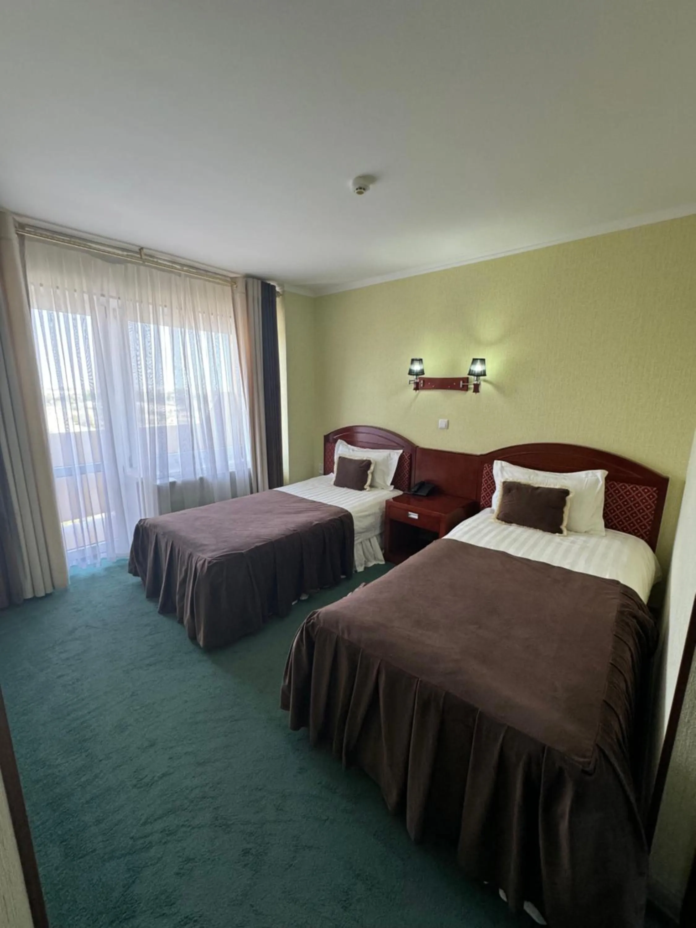 Bed in Hotel Grand Bukhara