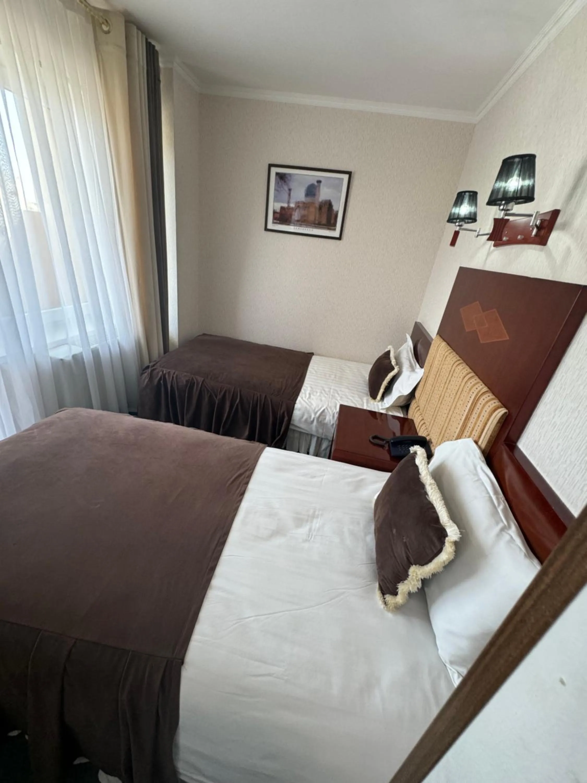 Bed in Hotel Grand Bukhara