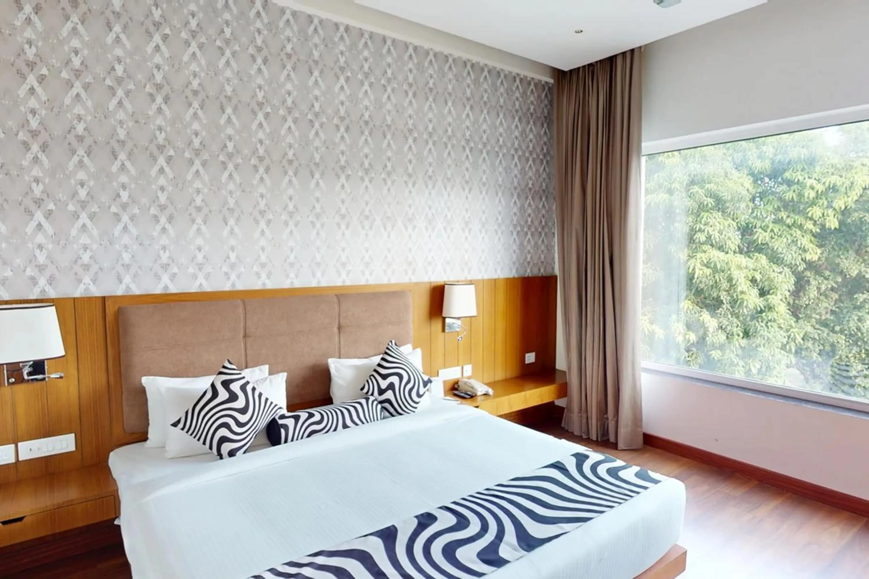 Bed in Sunday Resort & Spa by CheckIn Manesar Gurugram