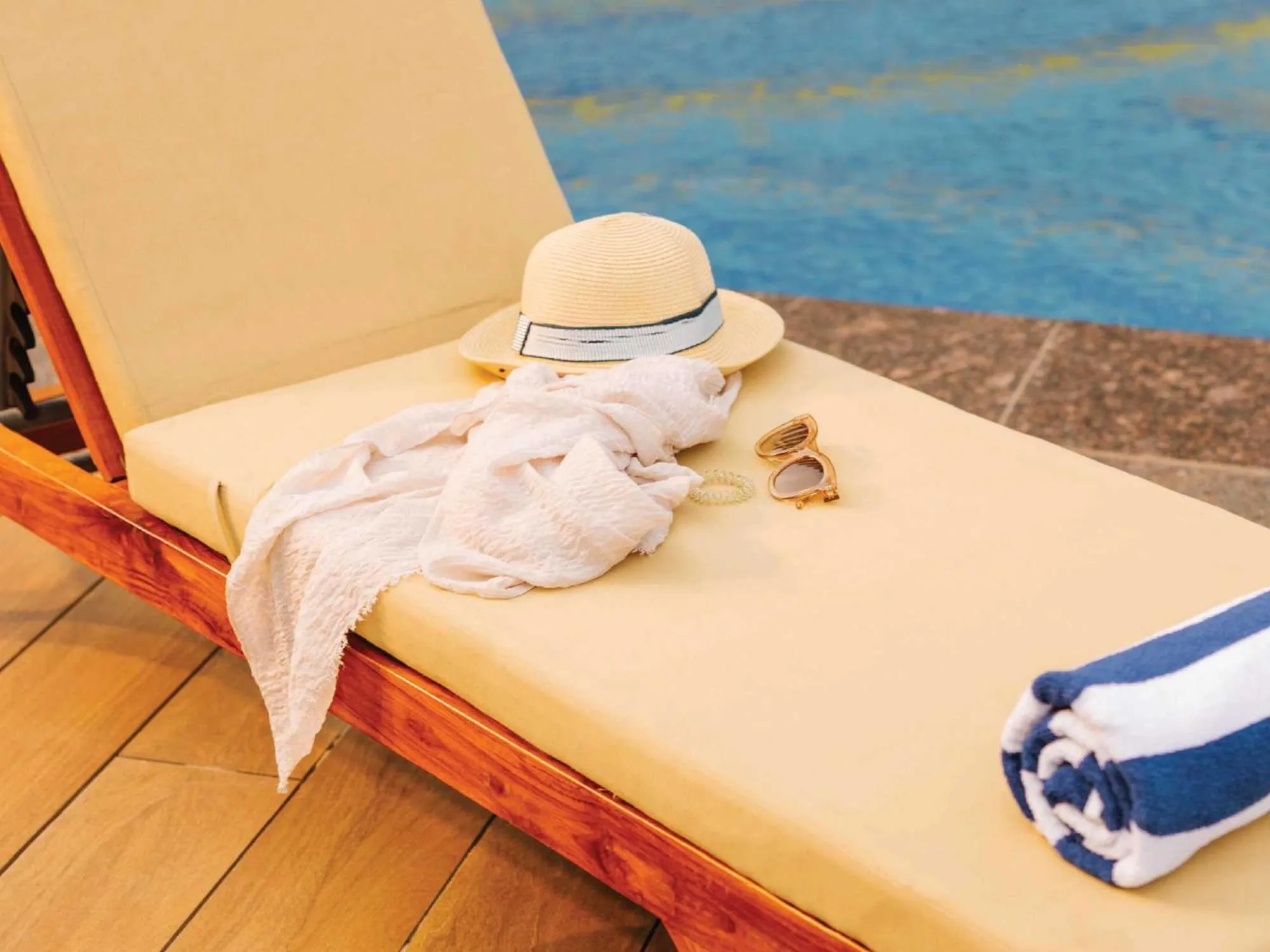 Swimming pool in Sunday Resort & Spa by CheckIn Manesar Gurugram