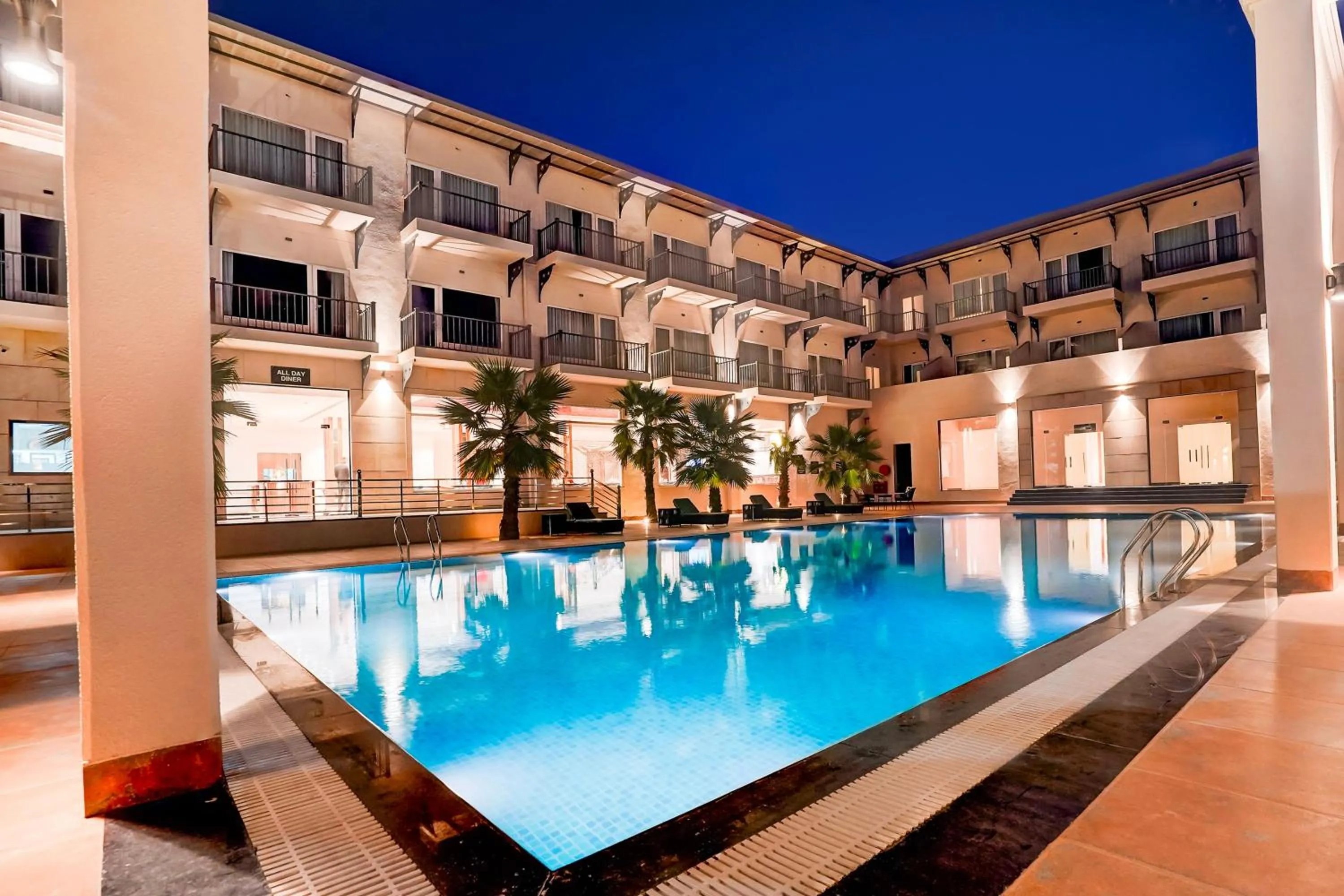 Swimming pool in Sunday Resort & Spa by CheckIn Manesar Gurugram