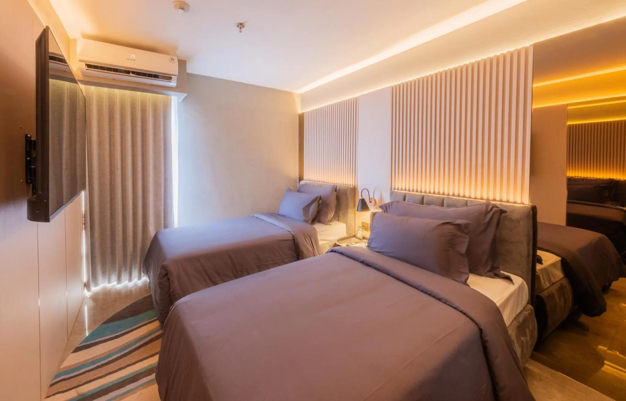 Bed in The All - Suite Pentacity Hotel Balikpapan