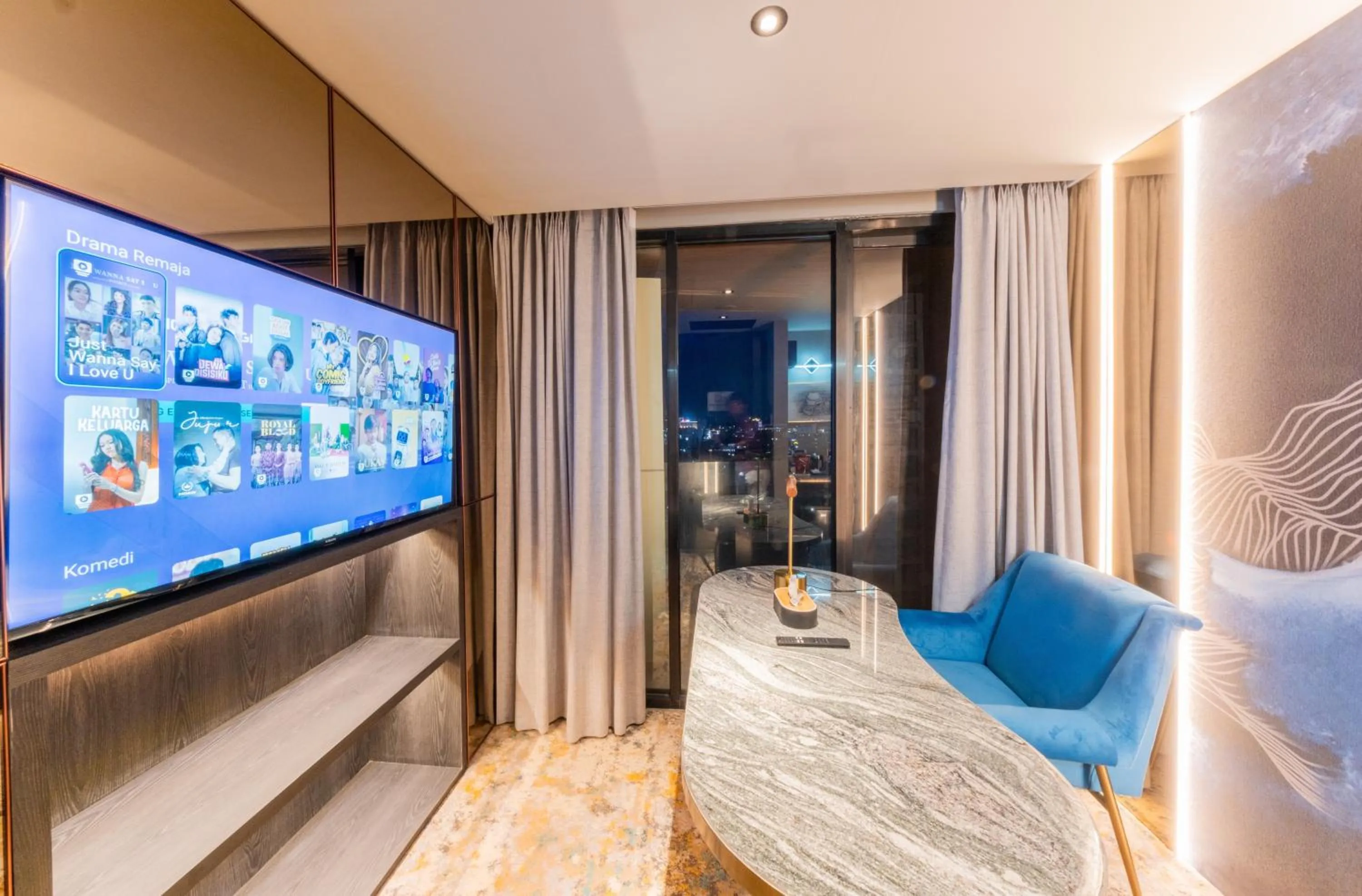 TV and multimedia, Bed in The All - Suite Pentacity Hotel Balikpapan