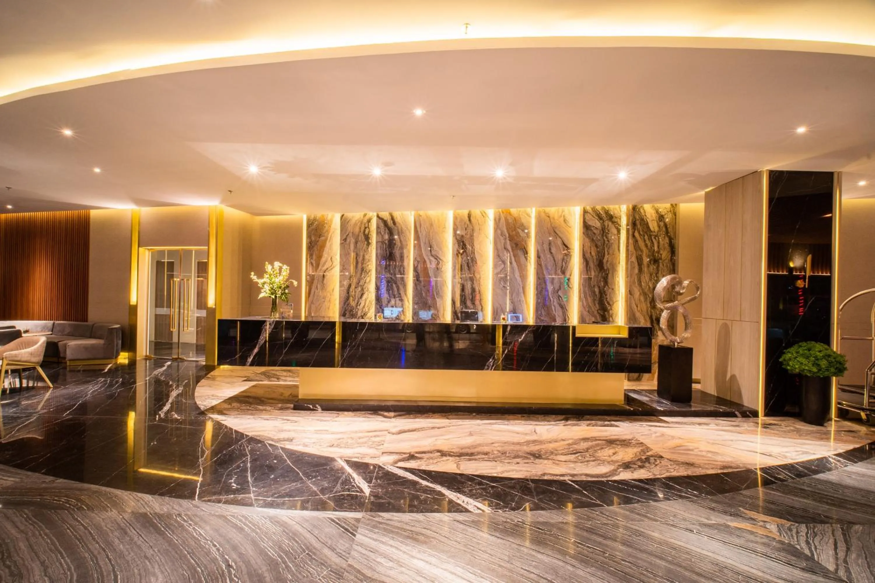 Lobby or reception in The All - Suite Pentacity Hotel Balikpapan