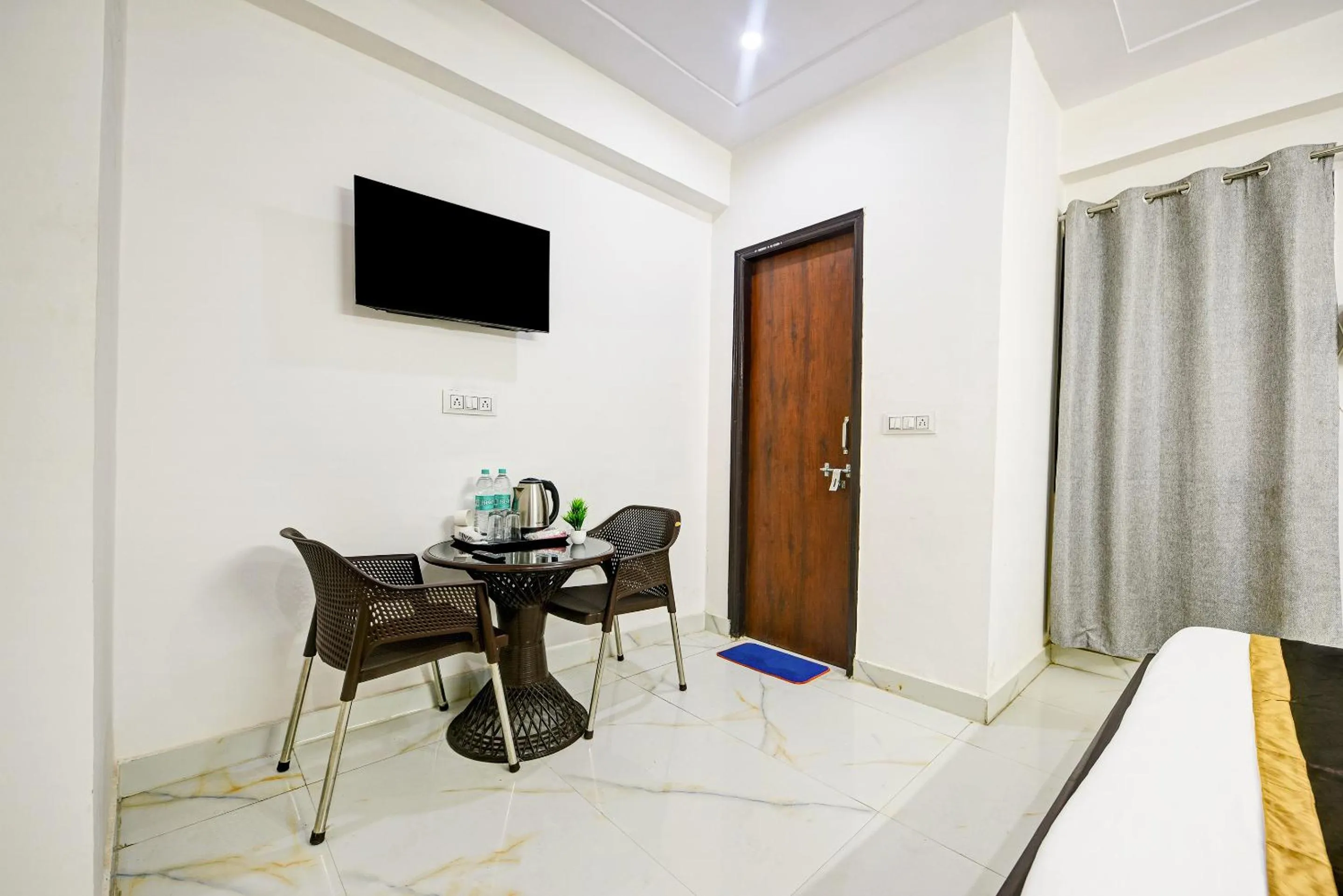 Bed in Hotel Krishna Tower