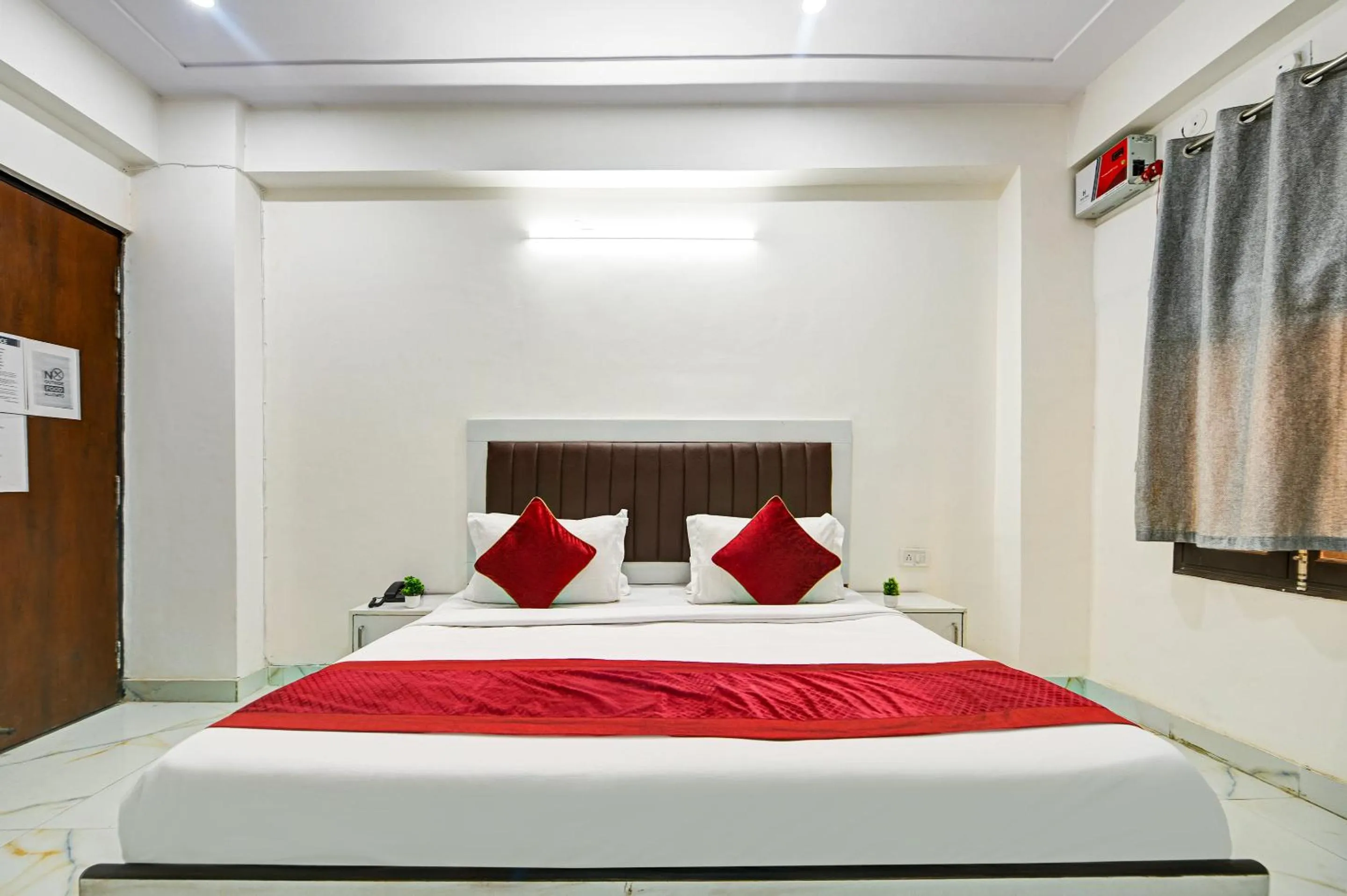 Bed in Hotel Krishna Tower