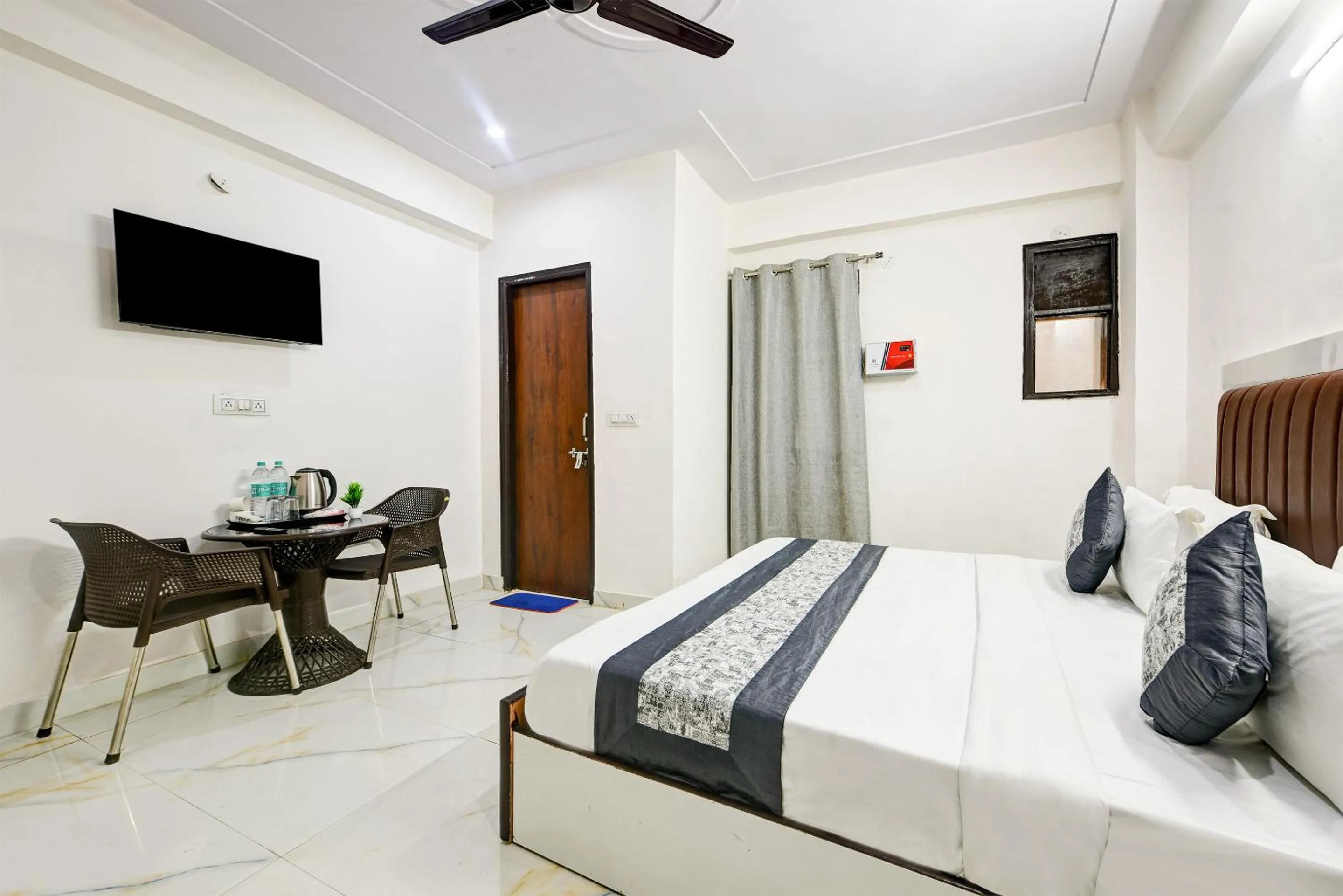 Bed in Hotel Krishna Tower