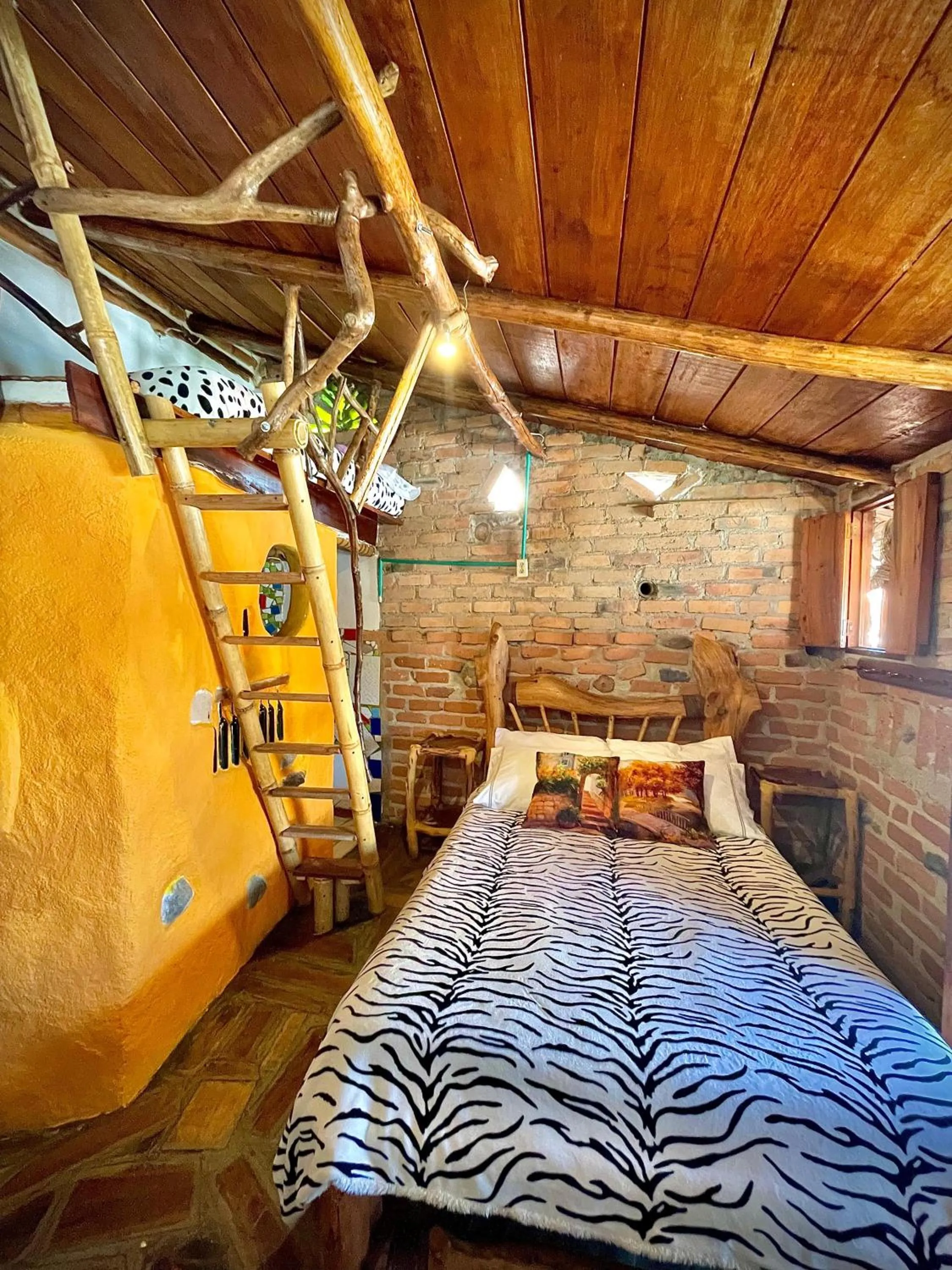 Bed in Hotel Casa Tarzan San Agustin