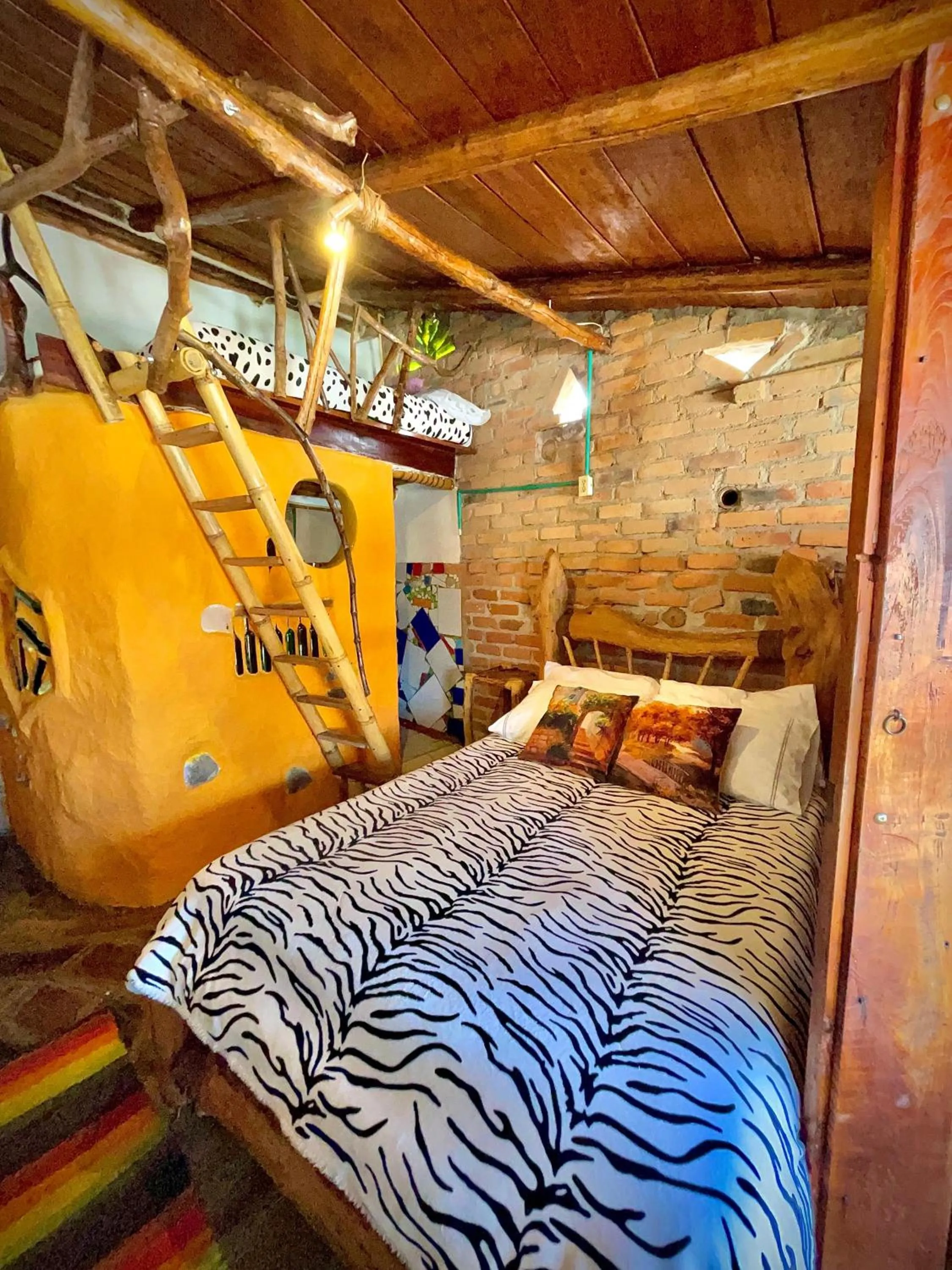 Bed in Hotel Casa Tarzan San Agustin