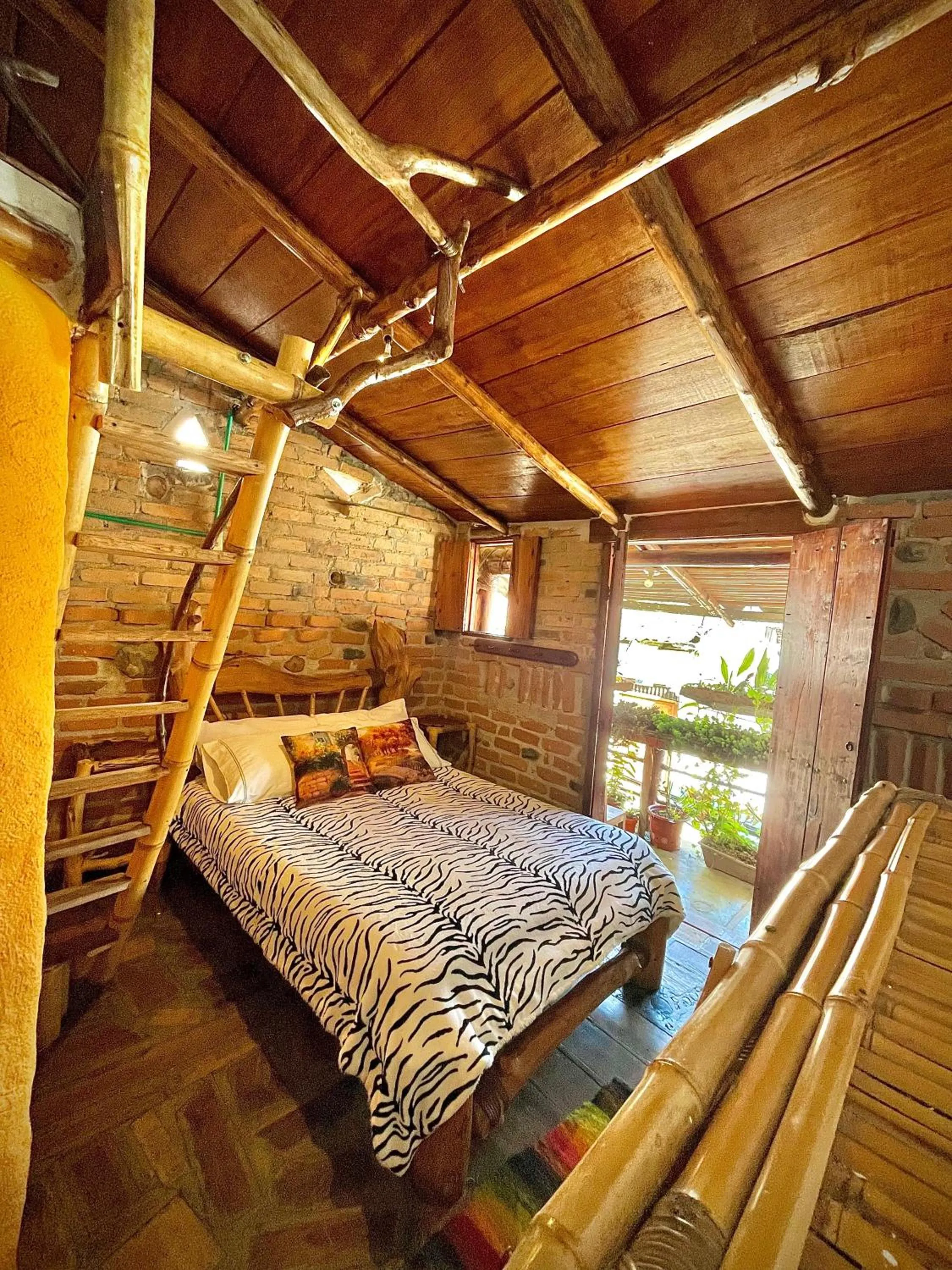Bed in Hotel Casa Tarzan San Agustin