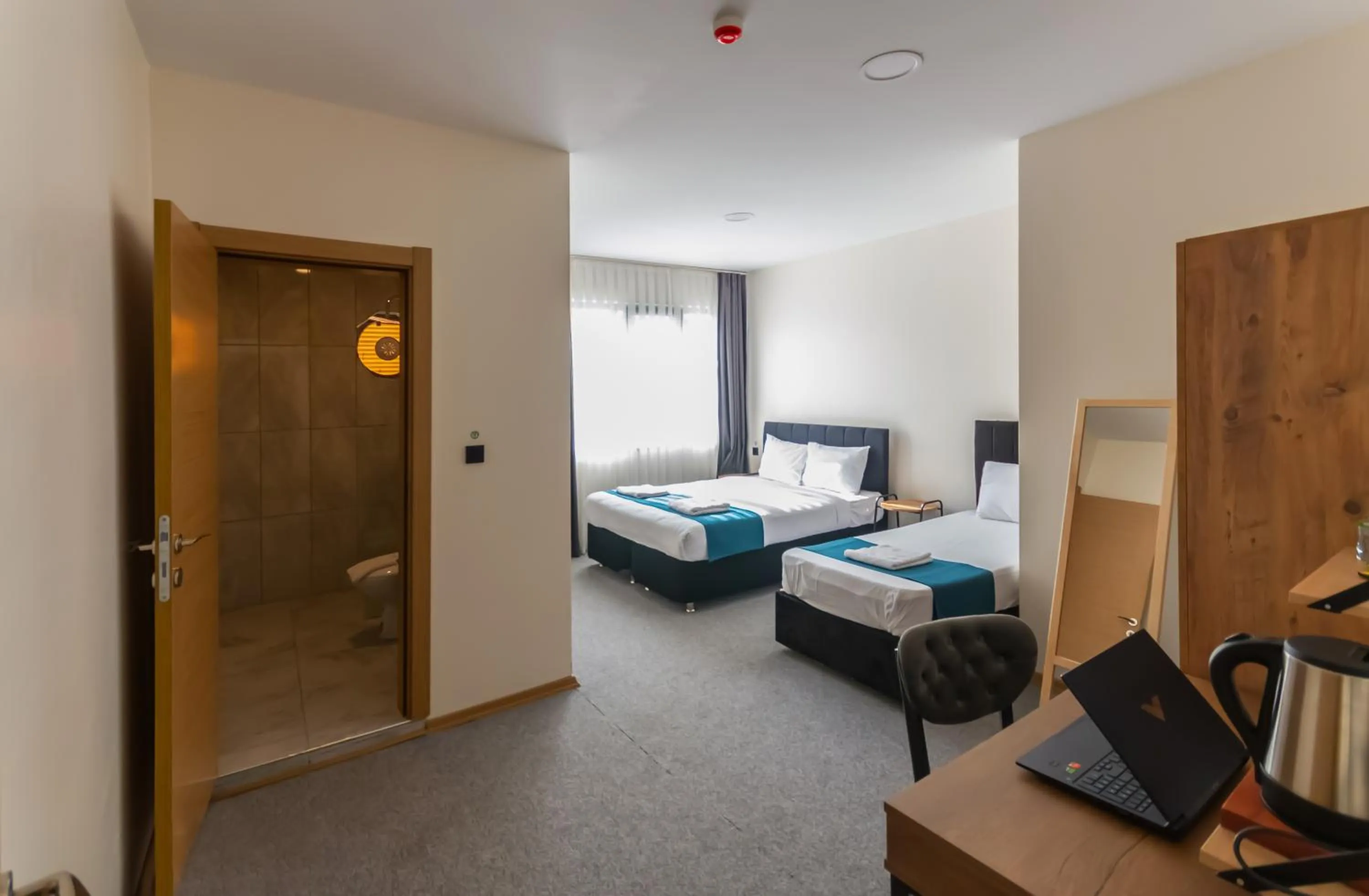 Photo of the whole room, Bed in New Garden Airport Hotel