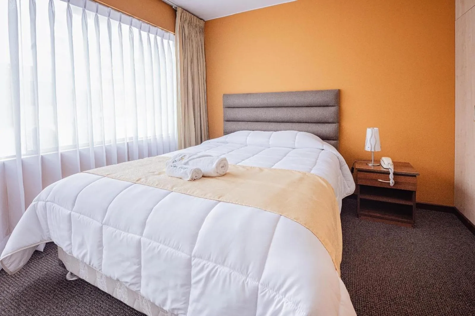 Bed in Hotel San Felipe Suites