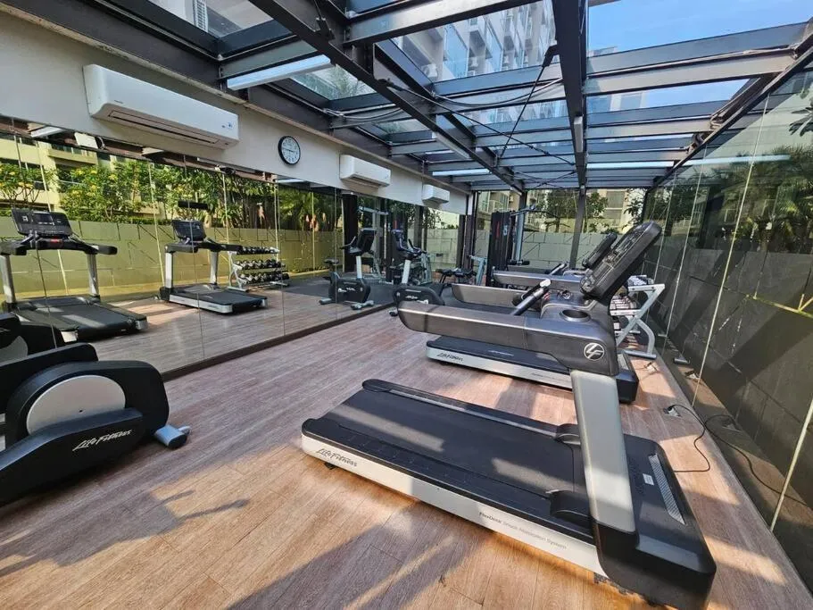 Fitness centre/facilities in Green Sedayu Apartment Suite by Ellison