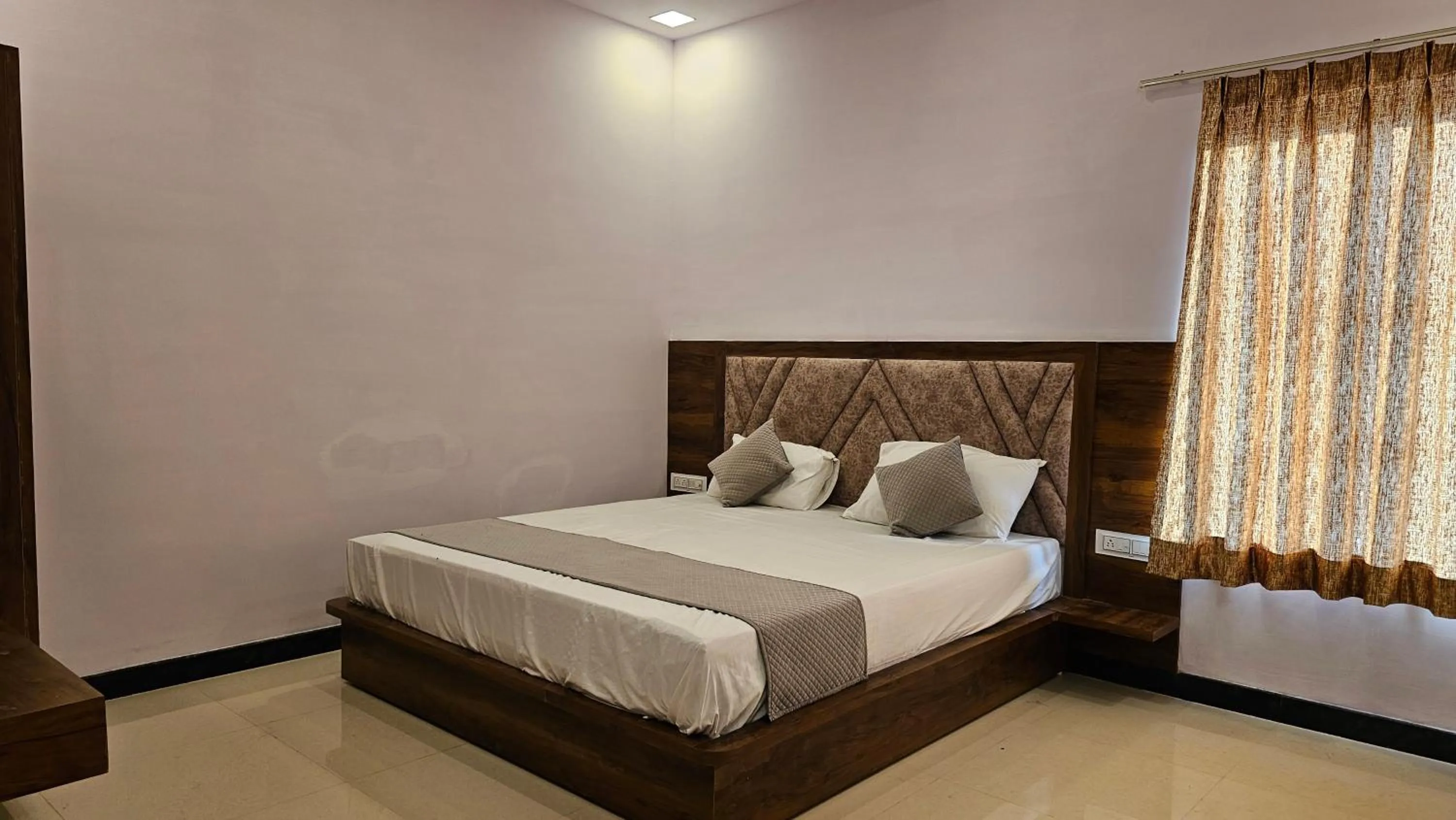 Bed in Braham Vatika Resort