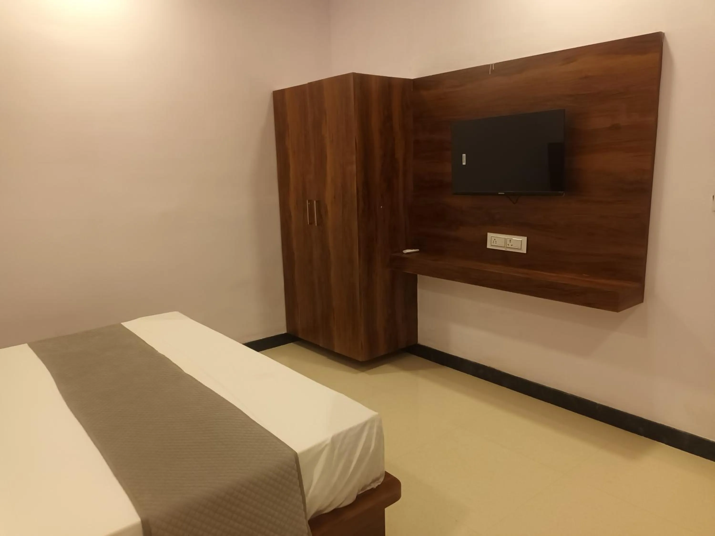 Bed in Braham Vatika Resort