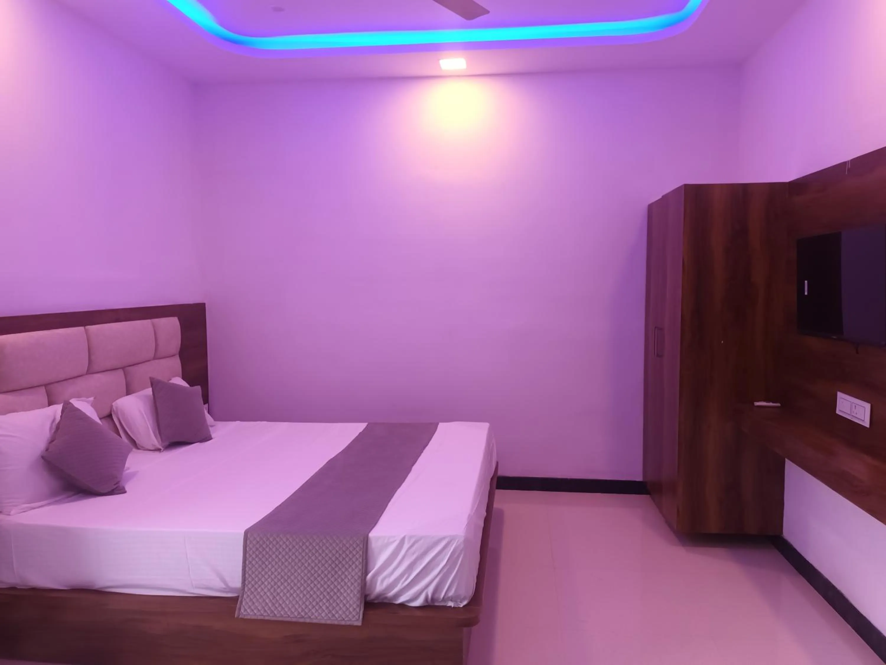 Communal lounge/ TV room, Bed in Braham Vatika Resort