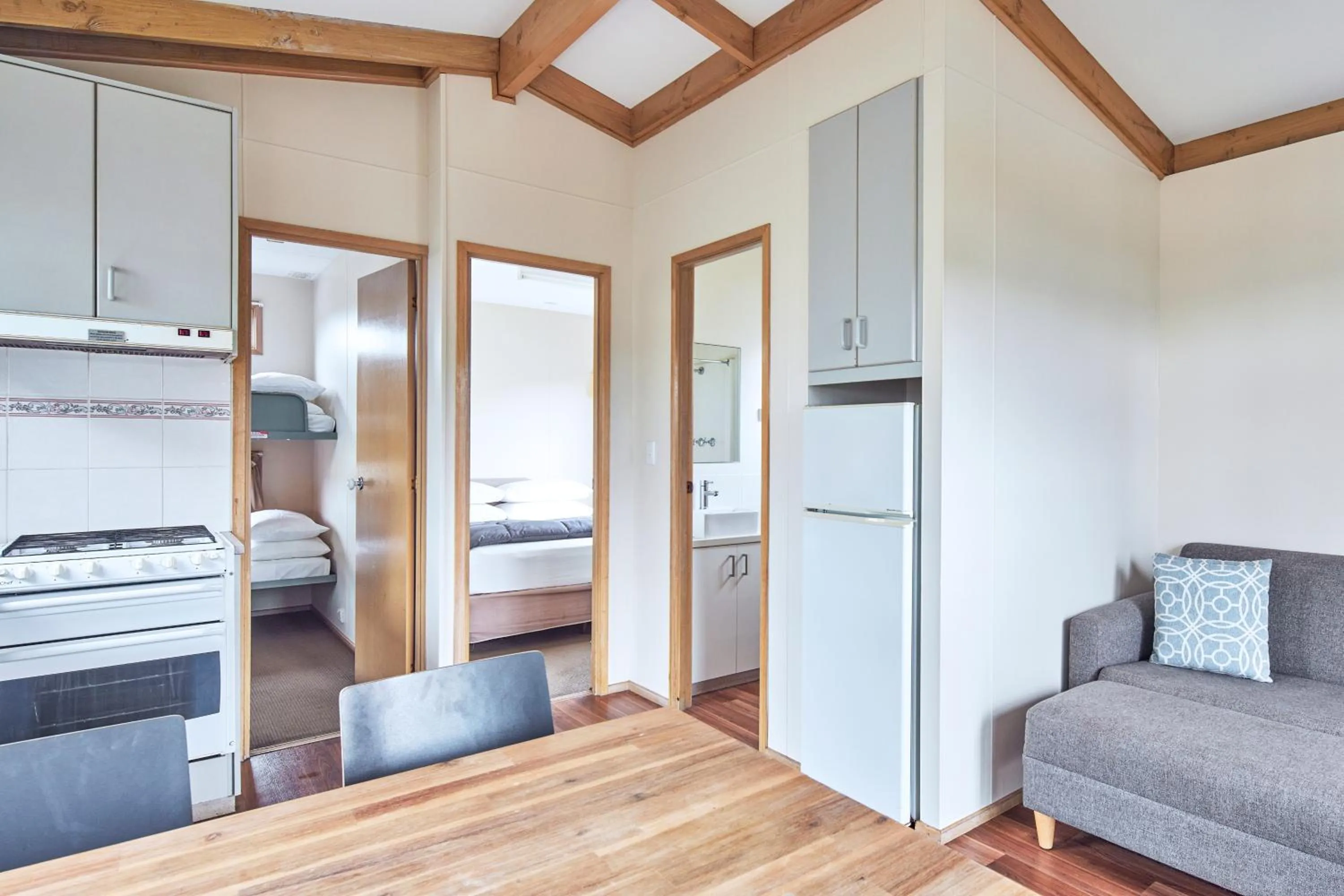 Living room, Bed in NRMA Merimbula Beach Holiday Resort