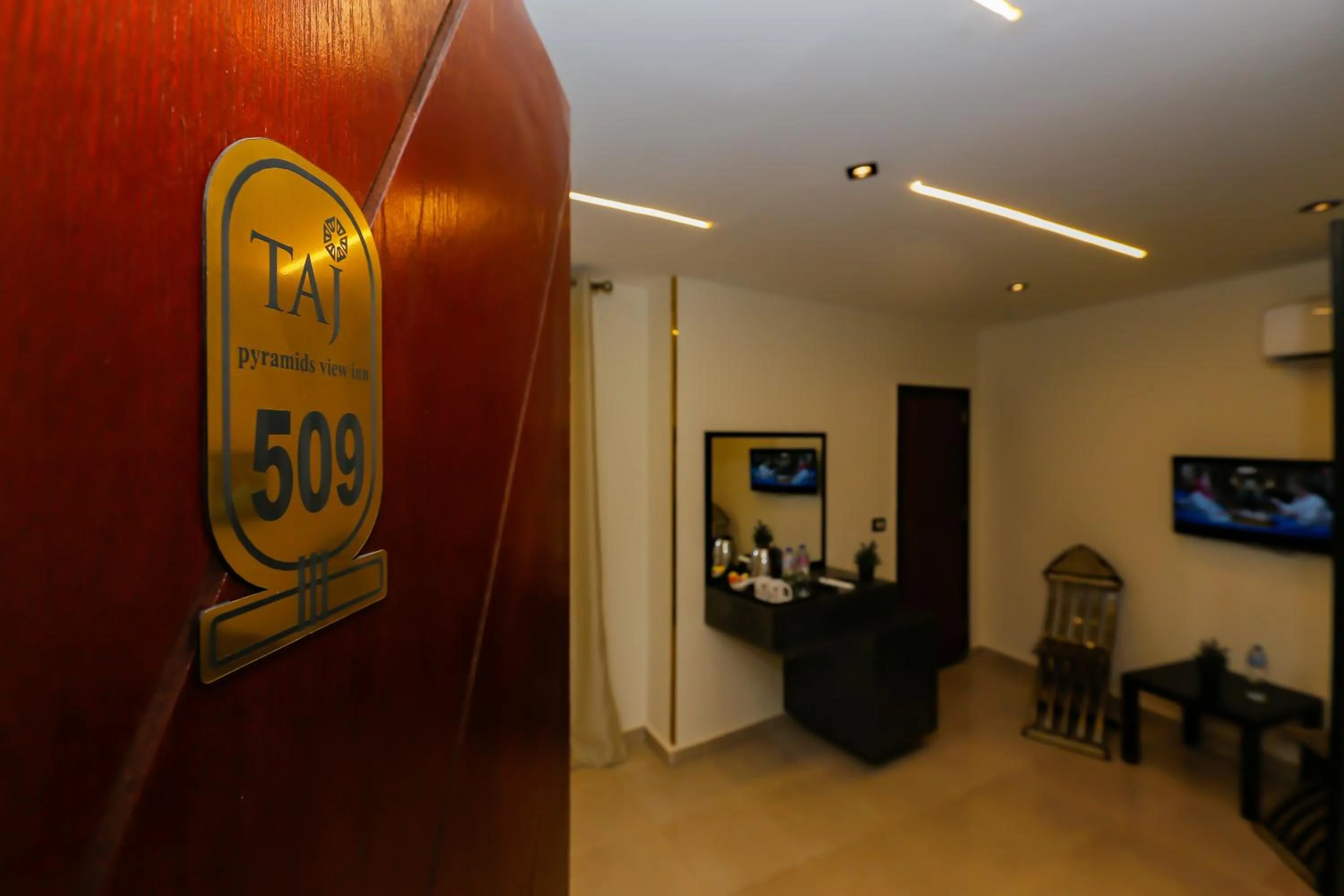 Property logo or sign in Taj Pyramids inn - Pyramids View Rooftop