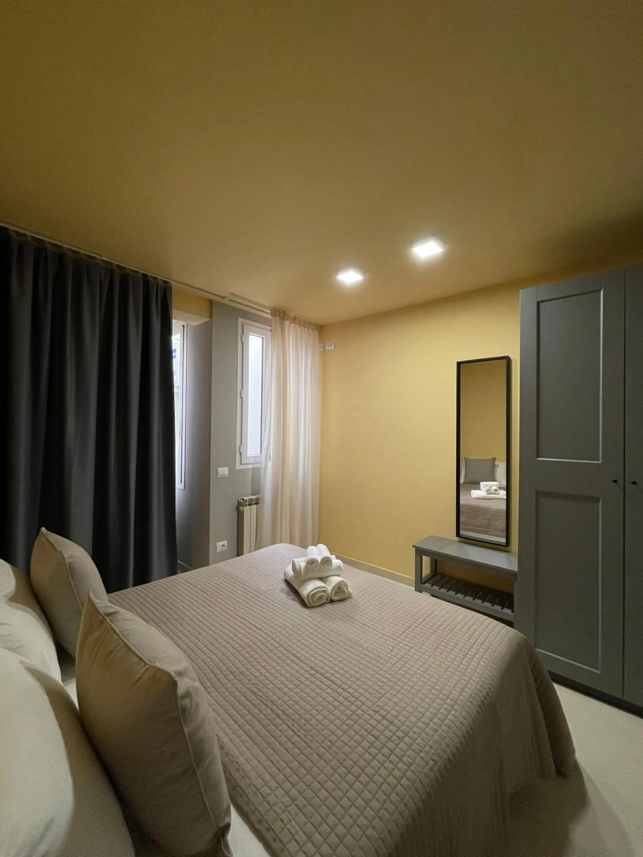 Bed in Apartment Hotel Marchesini