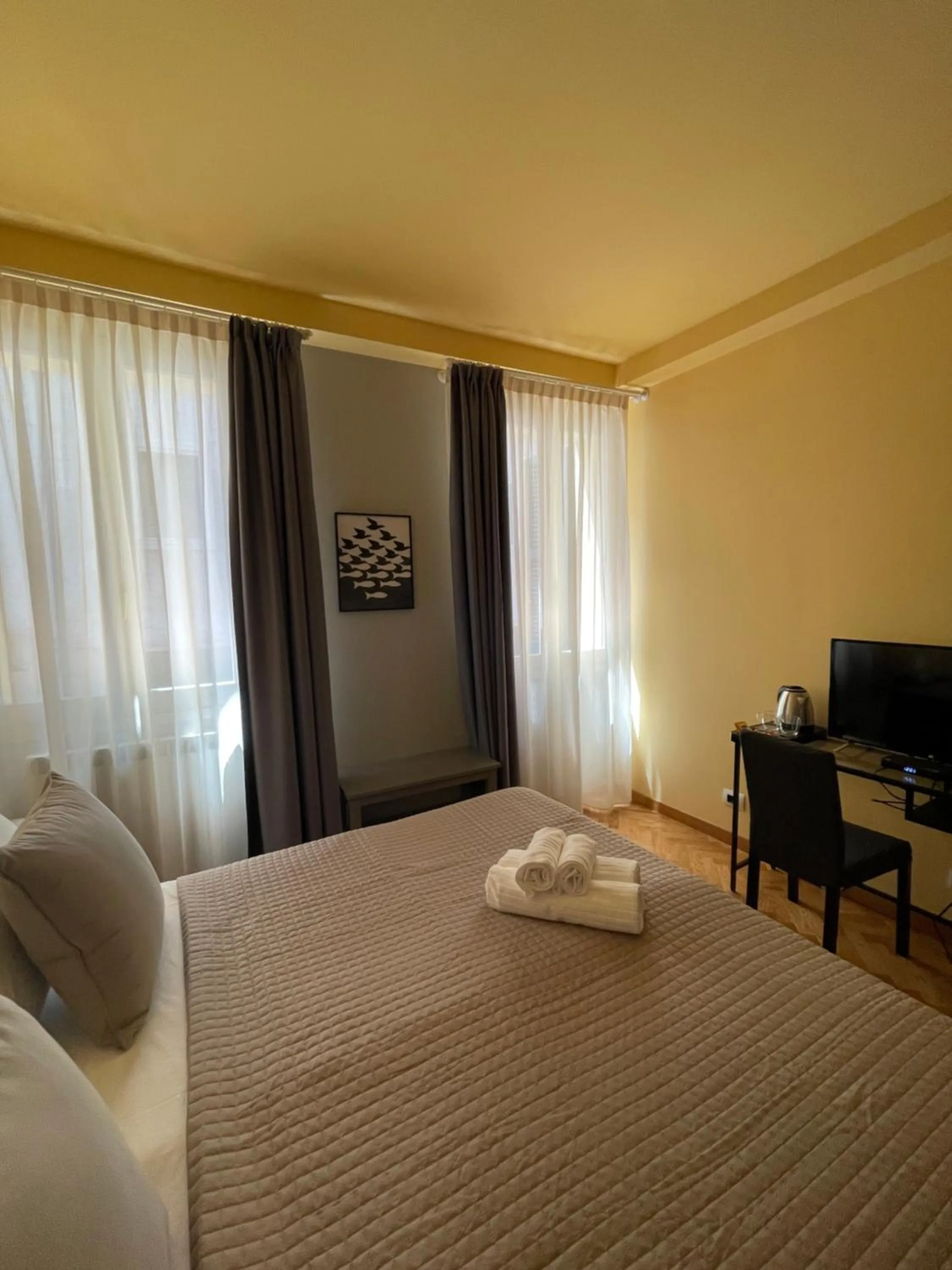 Bed in Apartment Hotel Marchesini