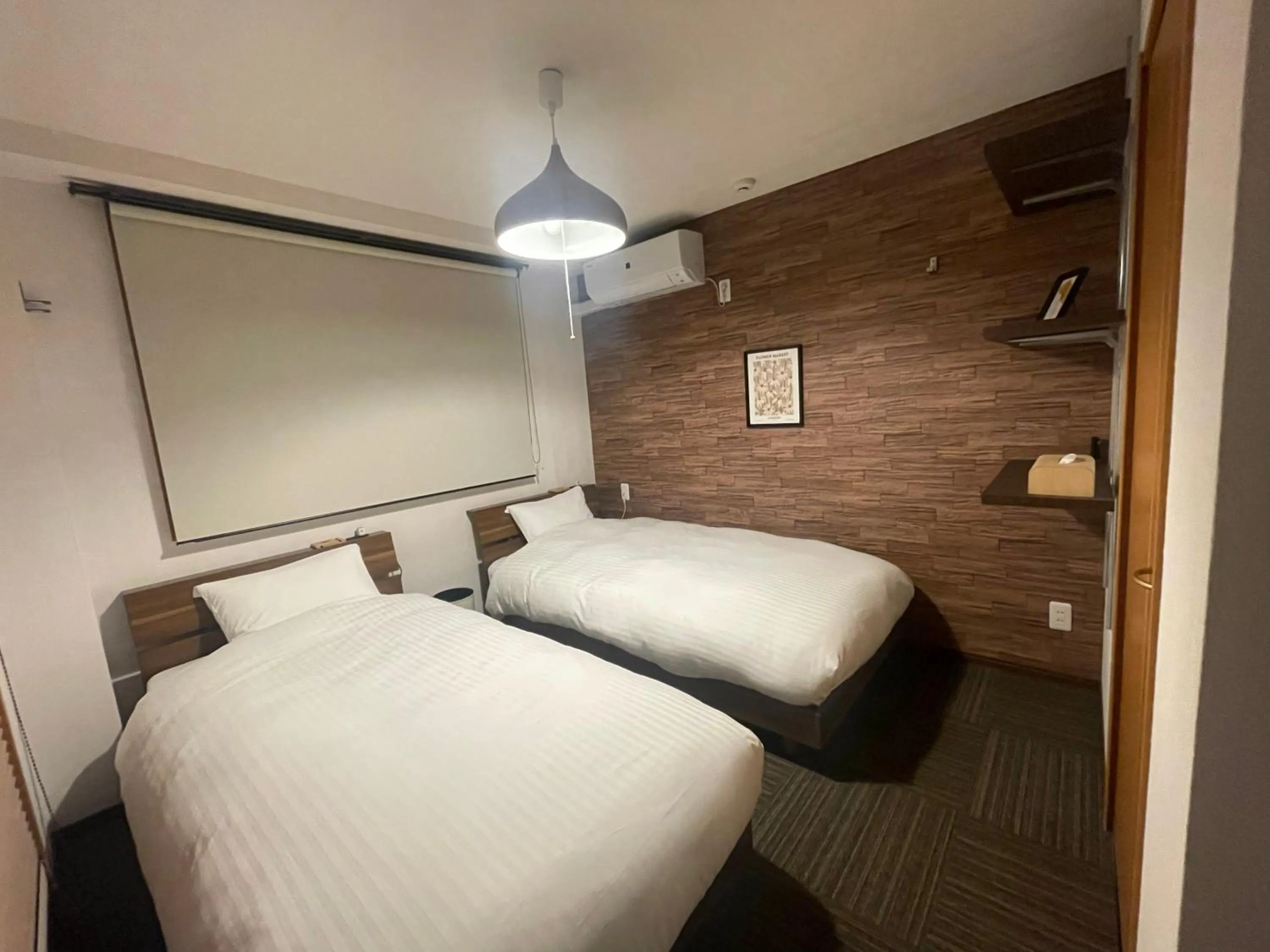 Bed in ritomaru rooms hakata hakozaki