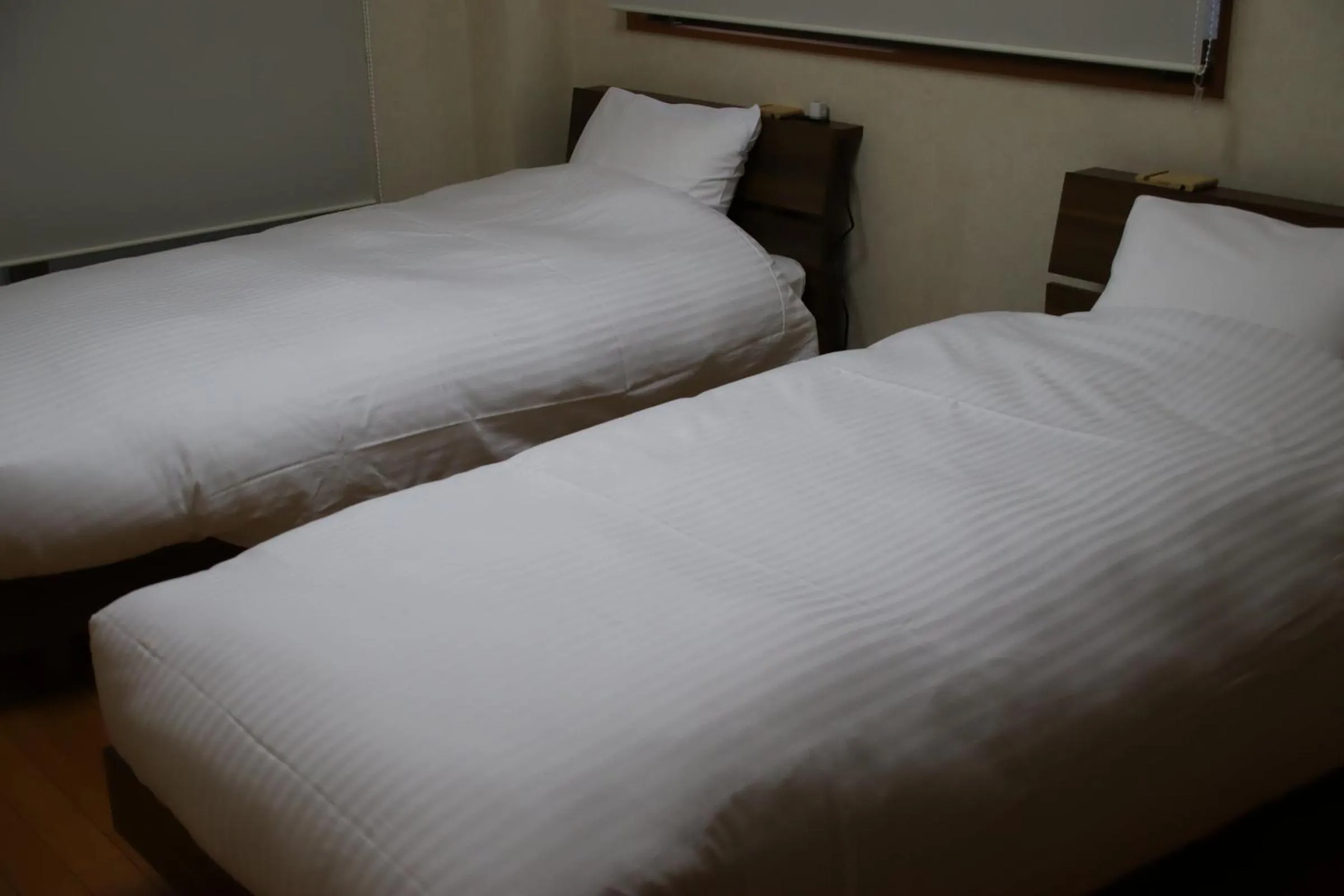 Bed in ritomaru rooms hakata hakozaki