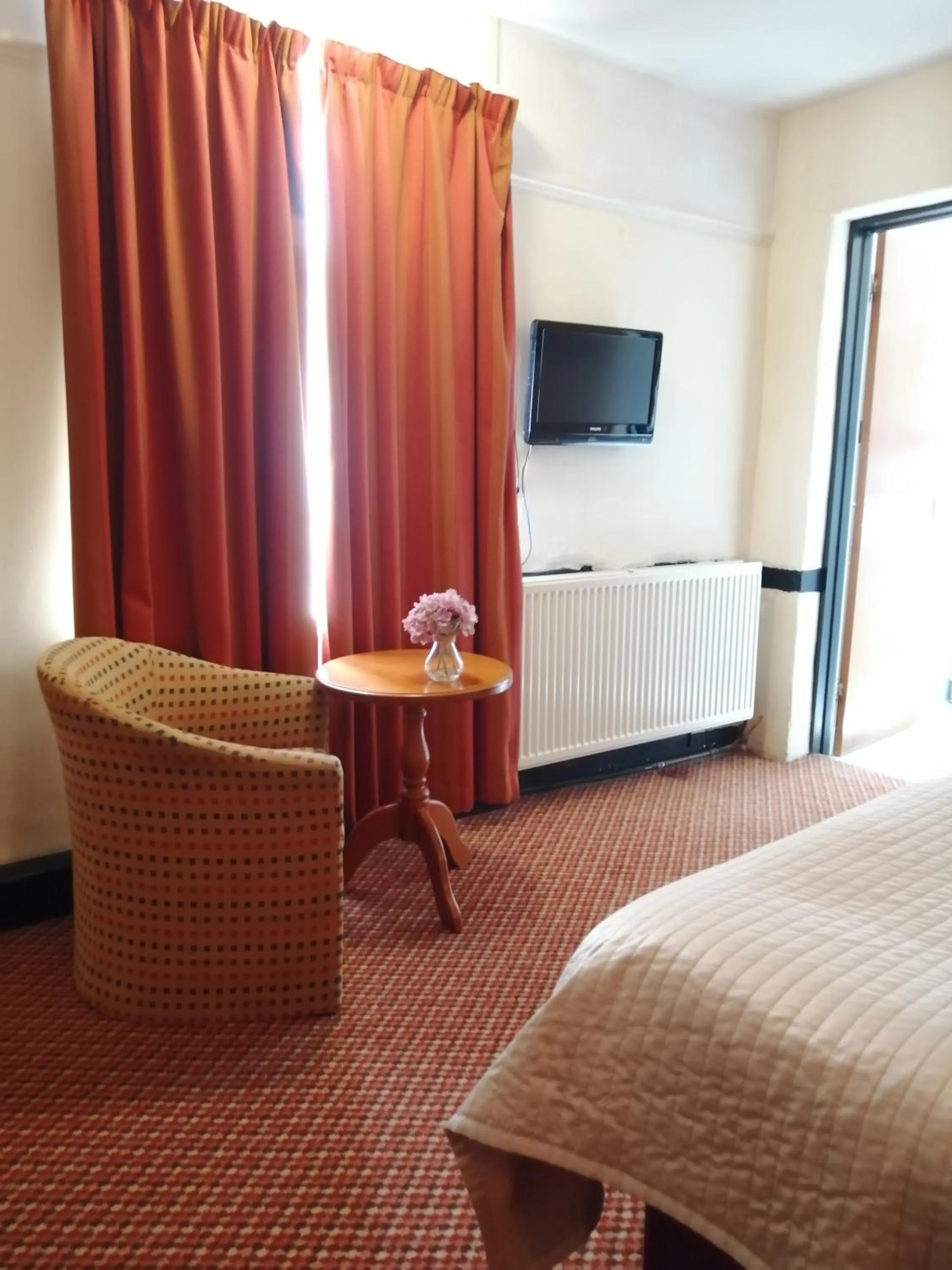 Bed in The Tudor Hotel