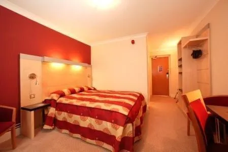 Bed in The Tudor Hotel