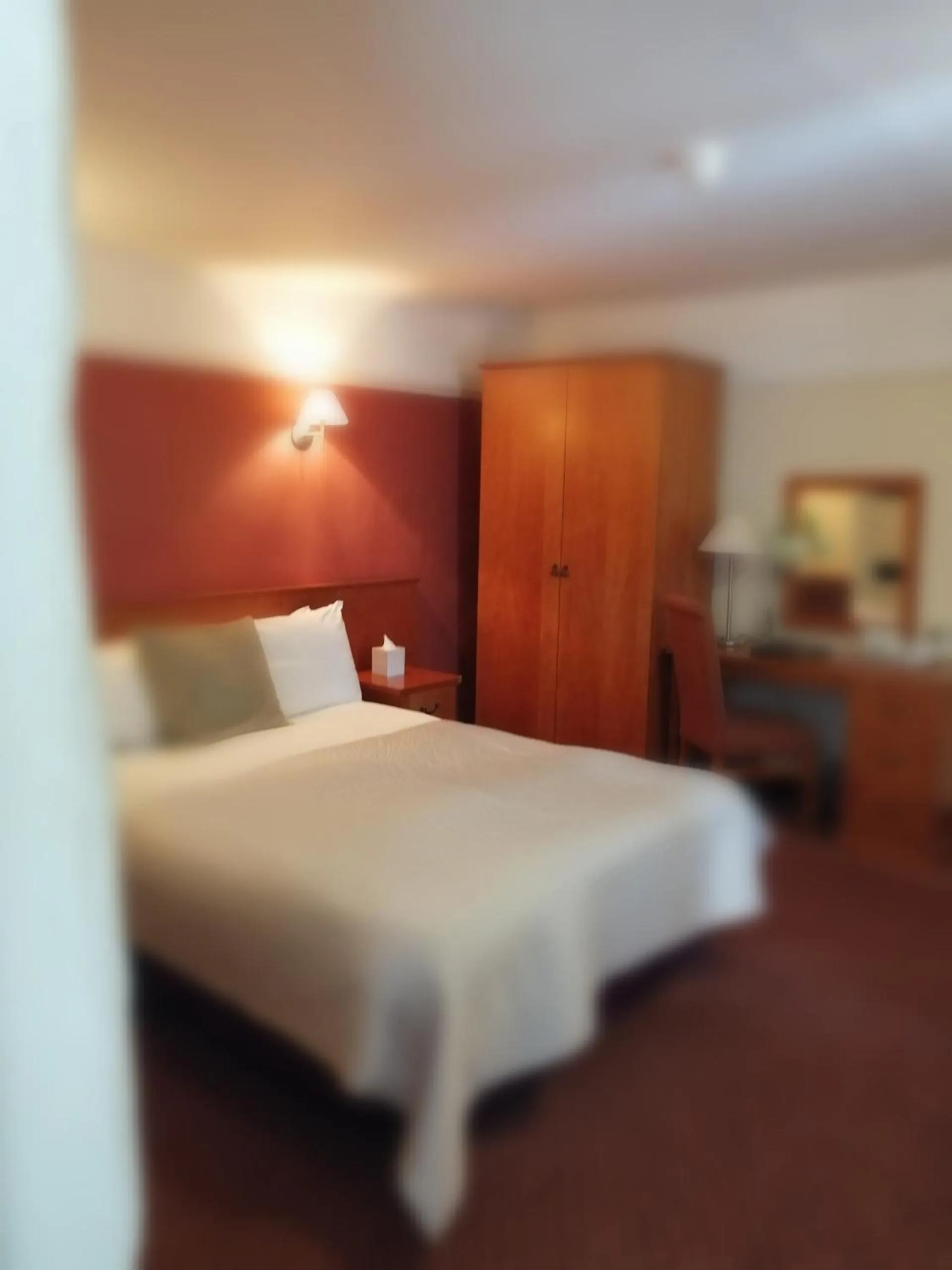 Bed in The Tudor Hotel