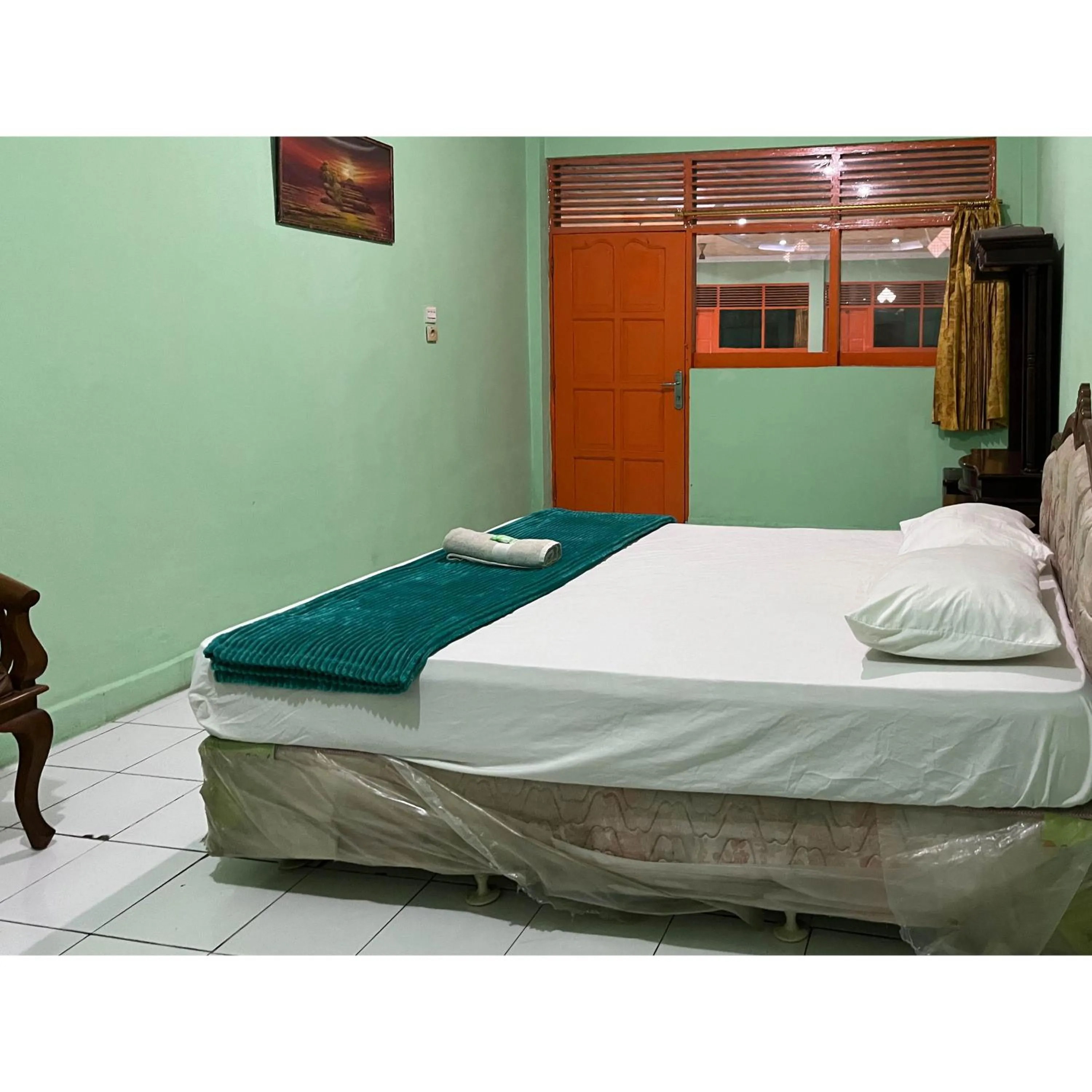 Bedroom, Bed in Afiat Hotel Maros Makassar RedPartner